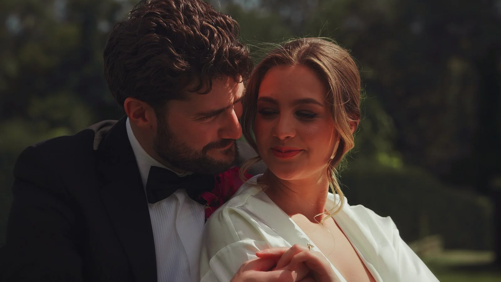 Fashion-led couple pose with editorial framing and calm movement in an intimate moment.