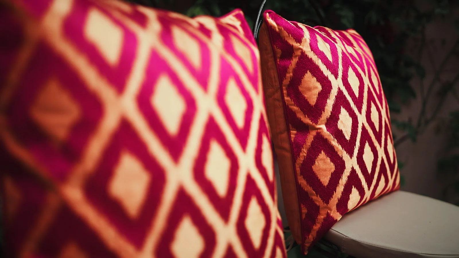 Detailing and patterns on orange and pink cushions.