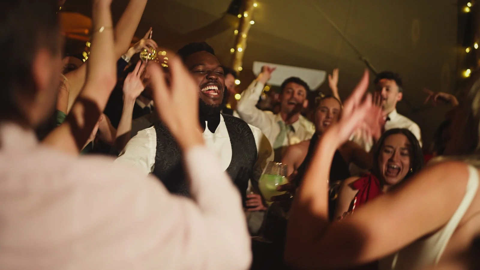 Candid moments from a colourful riverside wedding on the River Thames at an Oxfordshire country estate.