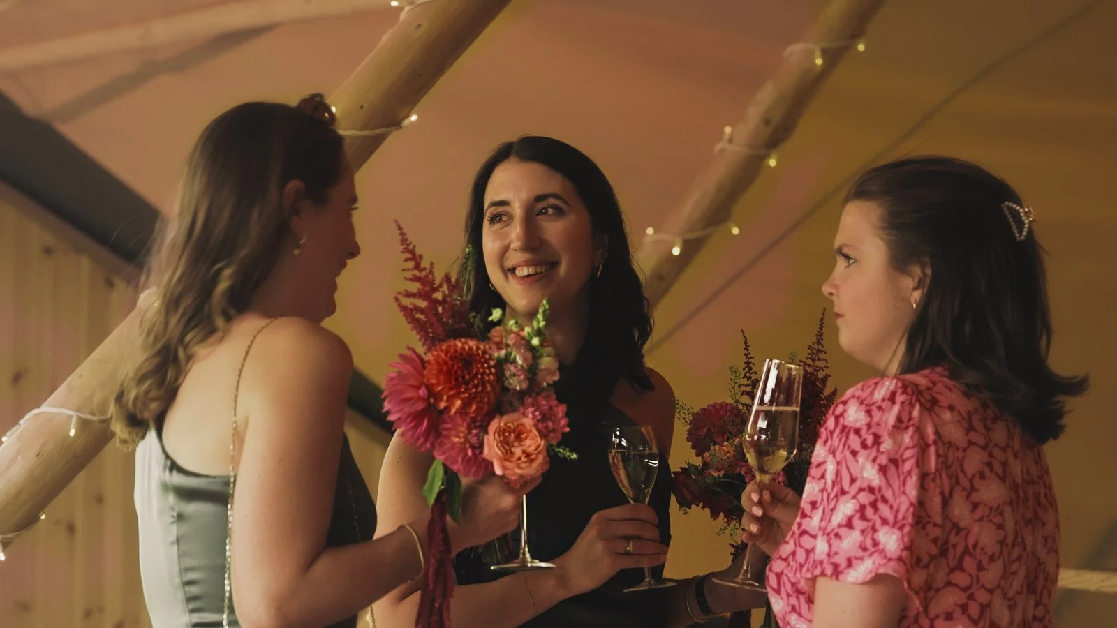 Guests and atmosphere from a colourful riverside wedding with black-tie styling and a marquee party on the Thames.