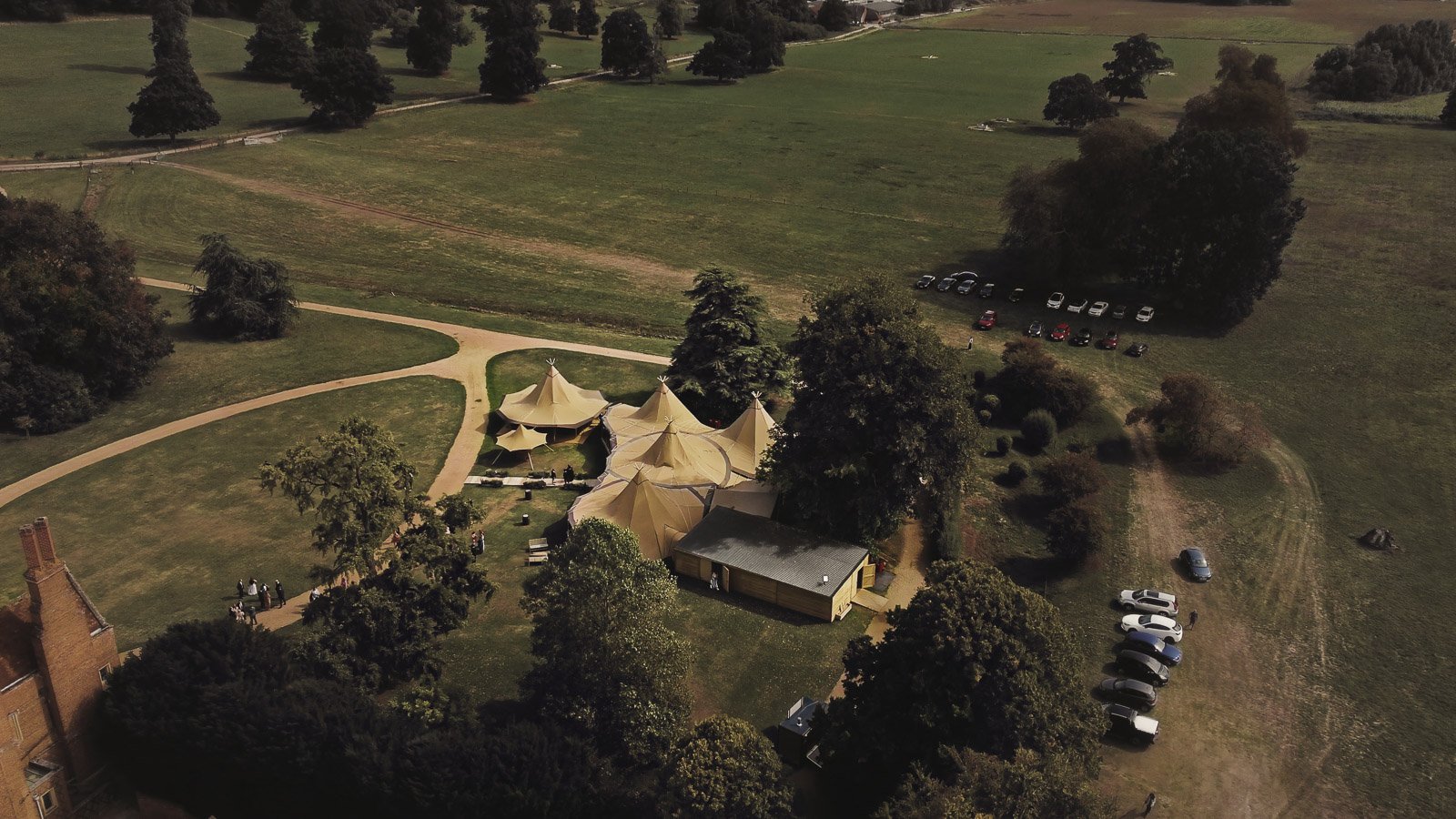 Details and candid scenes from a colourful riverside wedding video at an Oxfordshire estate beside the River Thames.