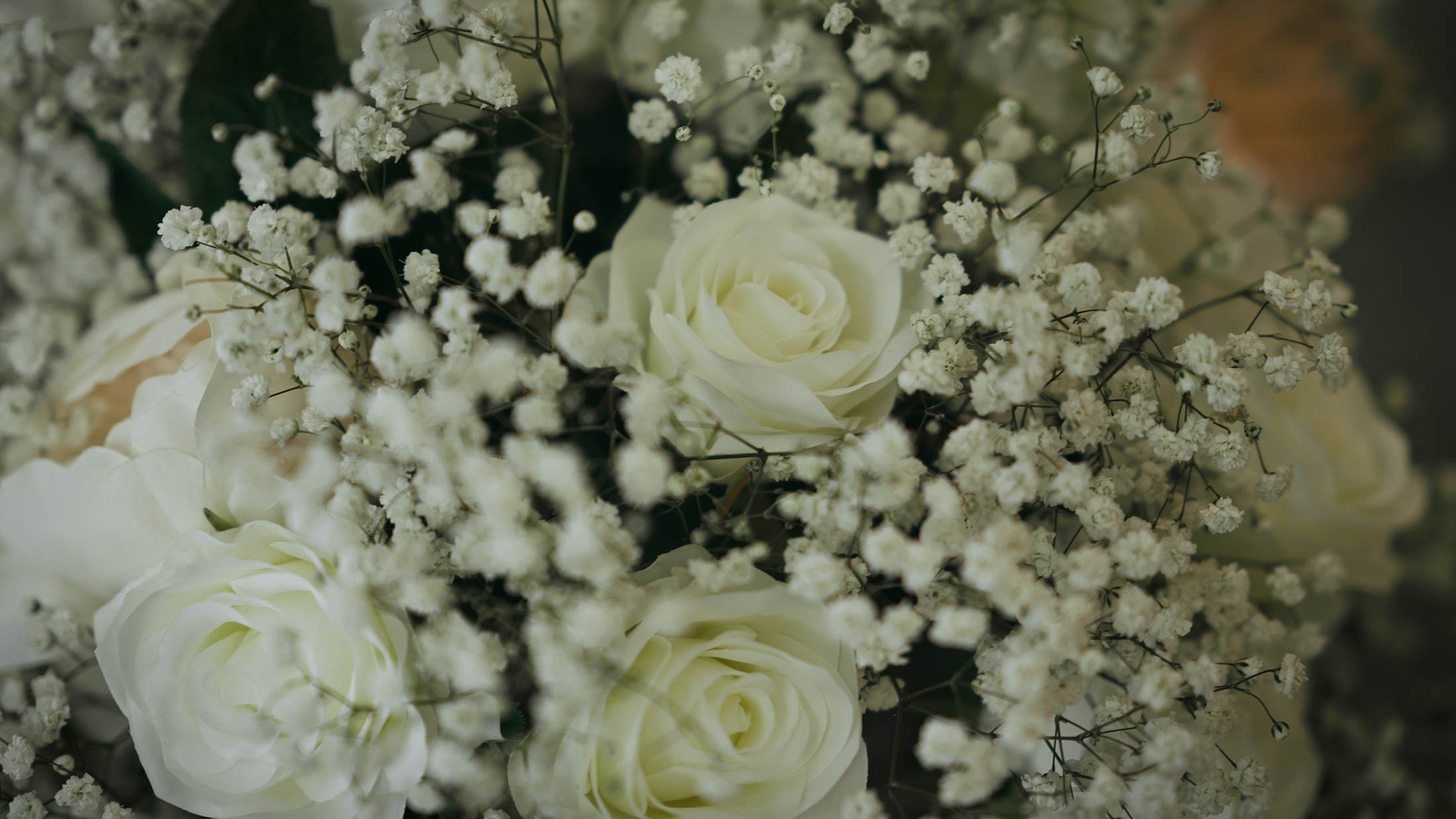 A close-up details shot of florals from a black and white themed wedding at The orangery.