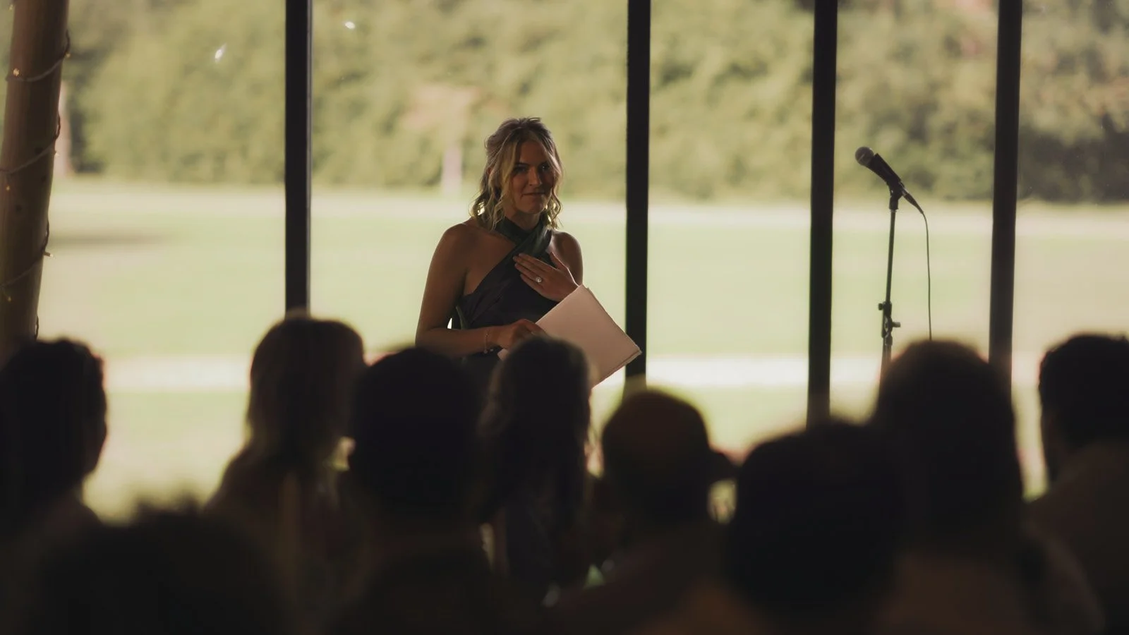 Editorial-style wedding photography from a colourful riverside celebration with bold florals and a marquee reception.