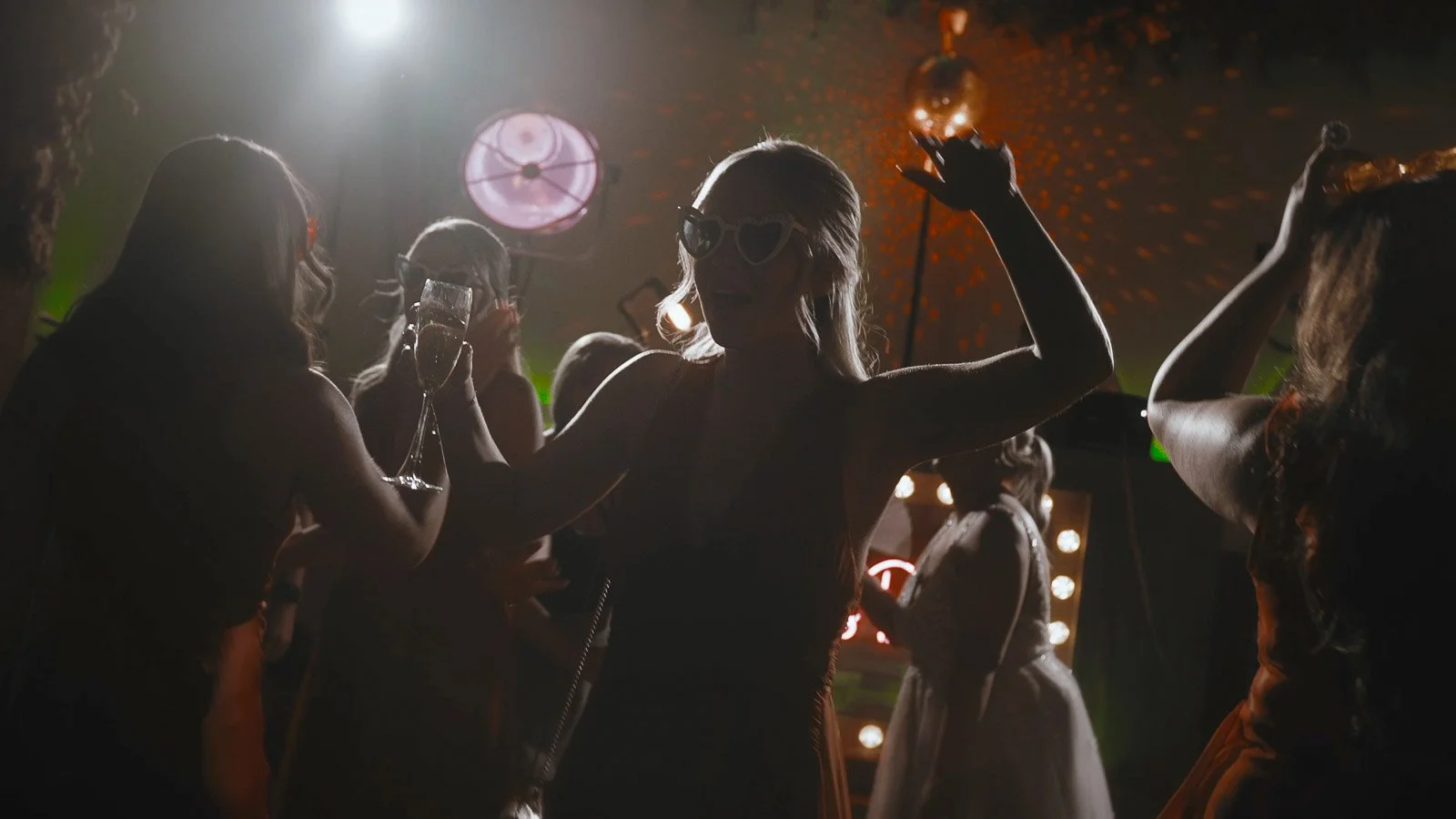 Guests party and dance together in a euphoric moment from a Winters Barns wedding film.
