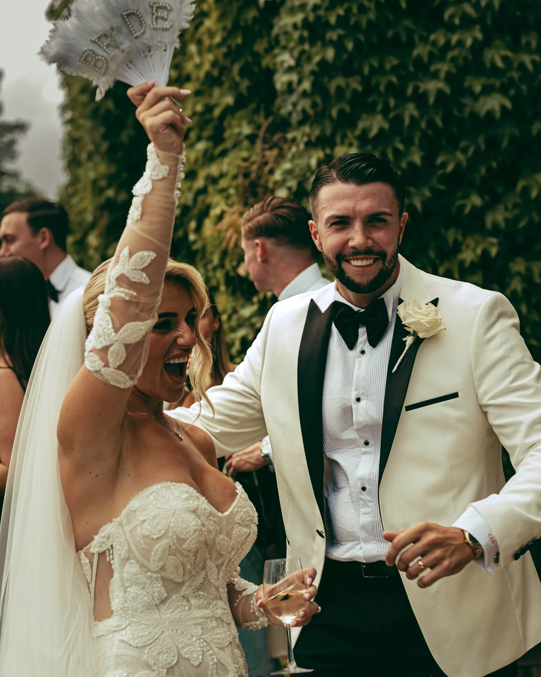 A couple dance during their outdoor wedding reception at Eastwell Manor, Kent, as they are captured by a cohesive photography and videography team.