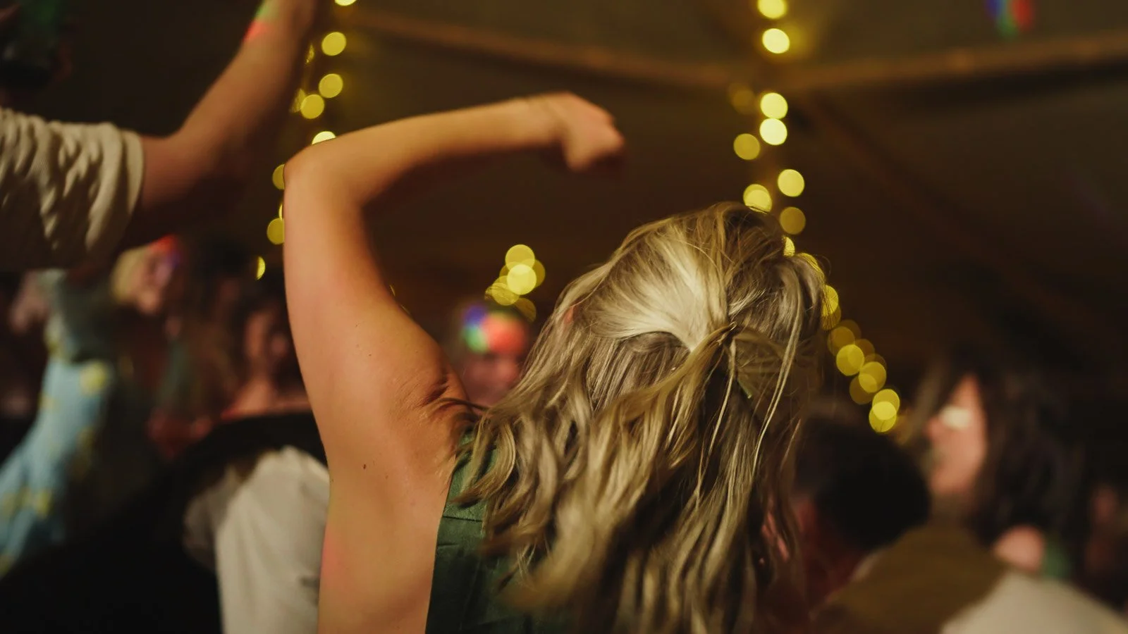 Guests and atmosphere from a colourful riverside wedding with black-tie styling and a marquee party on the Thames.