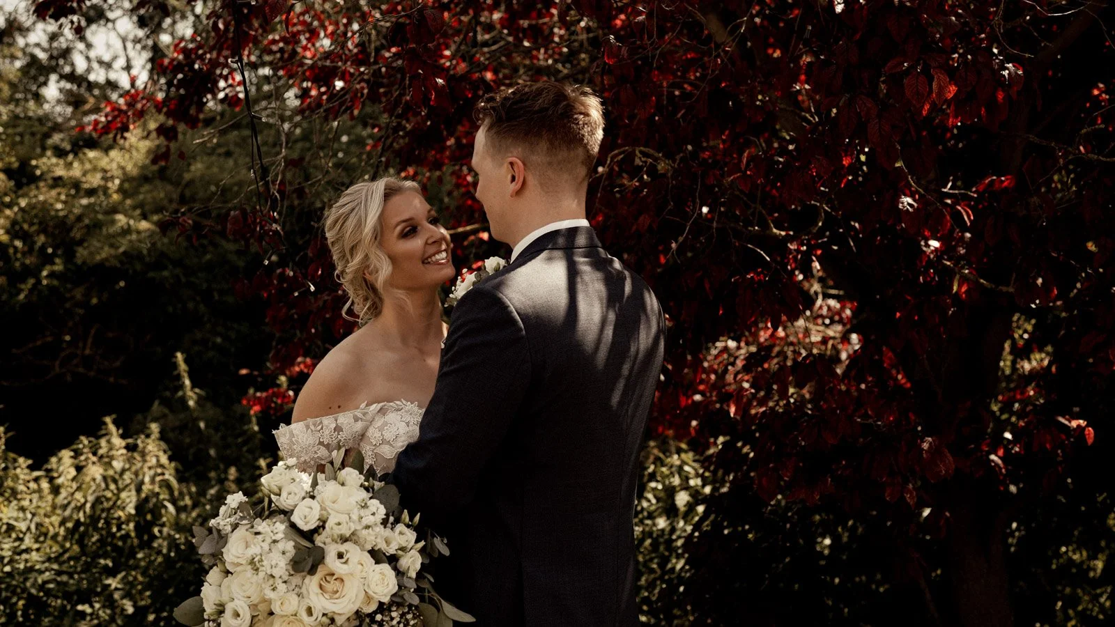A couple walk together during their wedding film at Cooling Castle Barn in Kent.