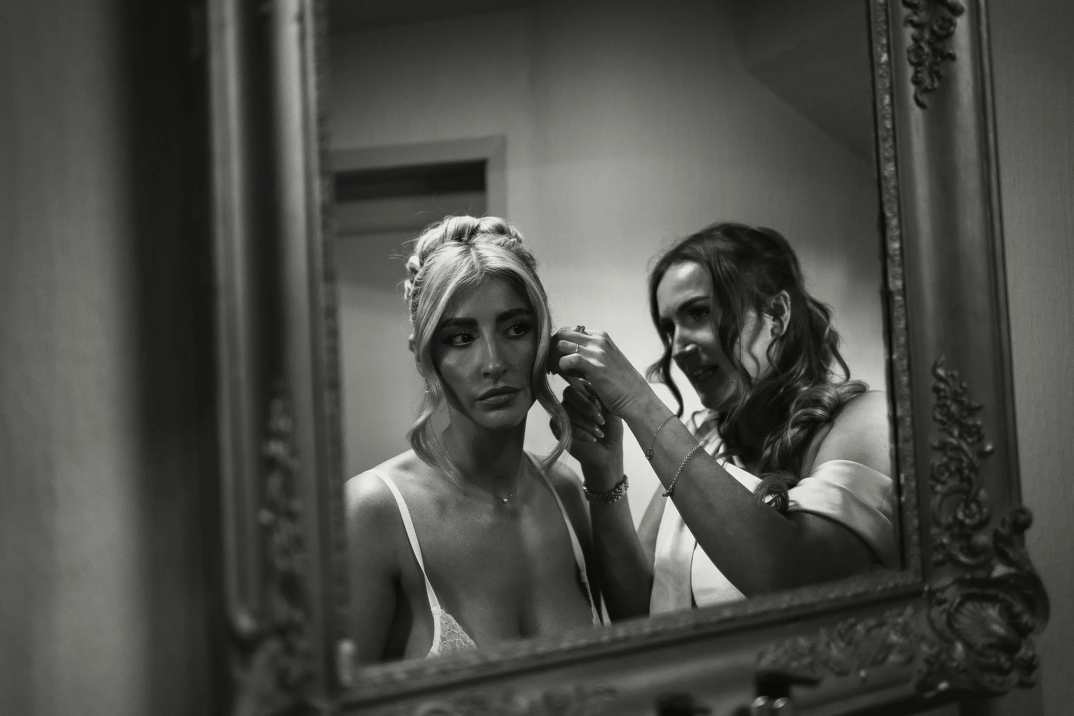Editorial wedding photography and videography moment of a brides reflection in a mirror during morning preparations at The Orangery Maidstone.