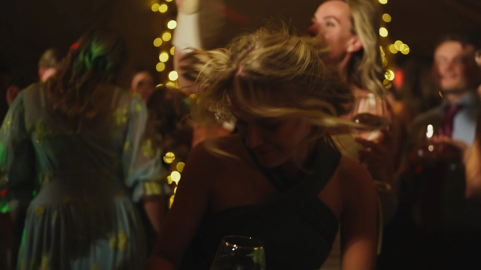 Guests and atmosphere from a colourful riverside wedding with black-tie styling and a marquee party on the Thames.