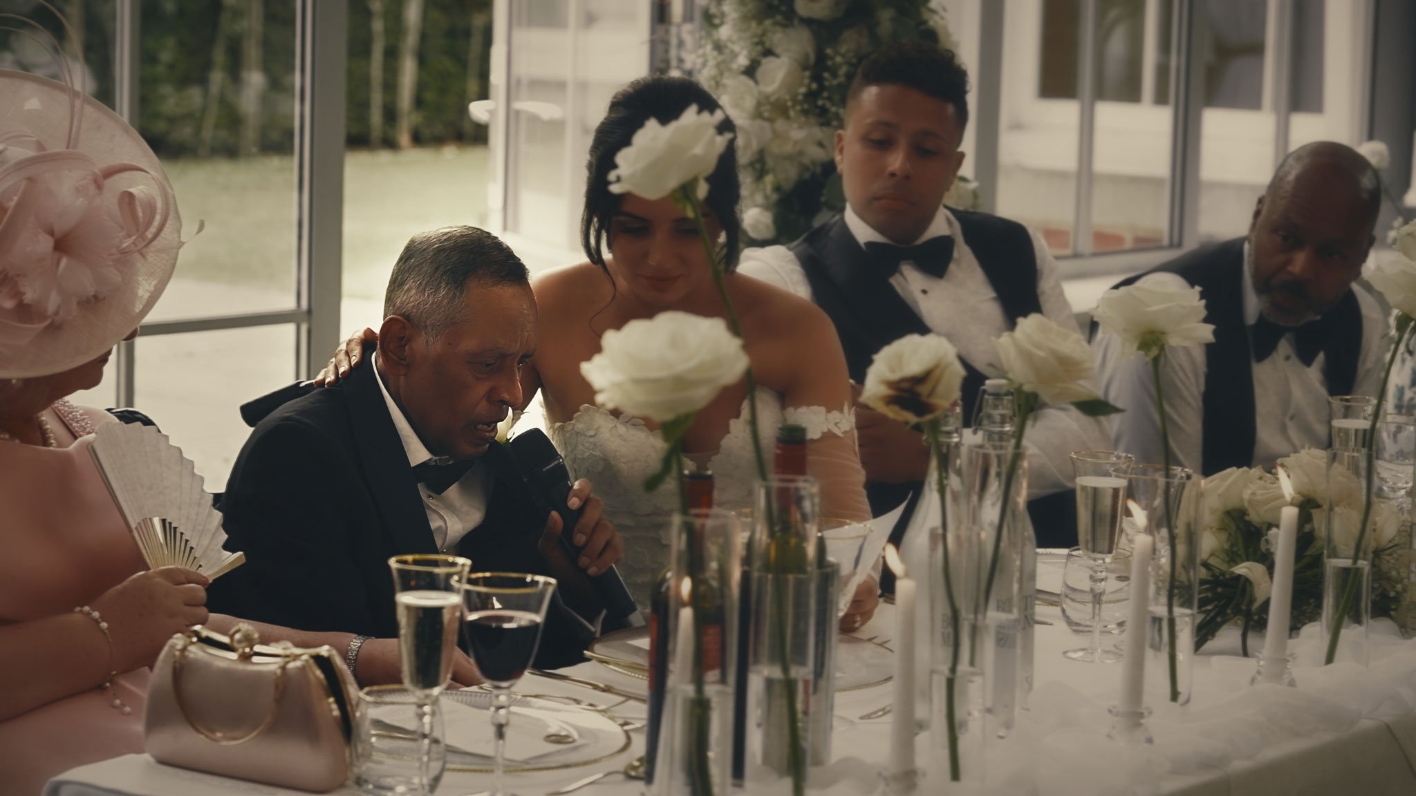 Close reactions during Atrium speeches at Botleys Mansion, highlighting laughter and emotion in the room.