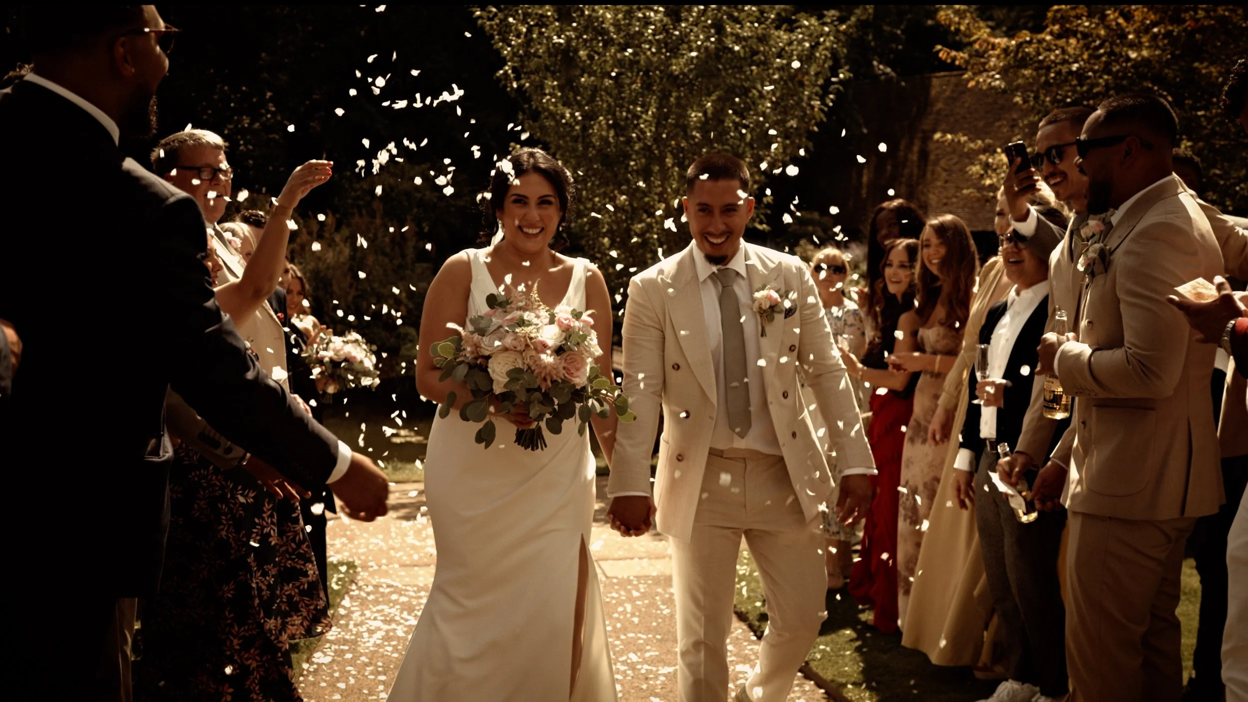 Confetti moment after a lakeside ceremony at The Orangery Maidstone in Kent