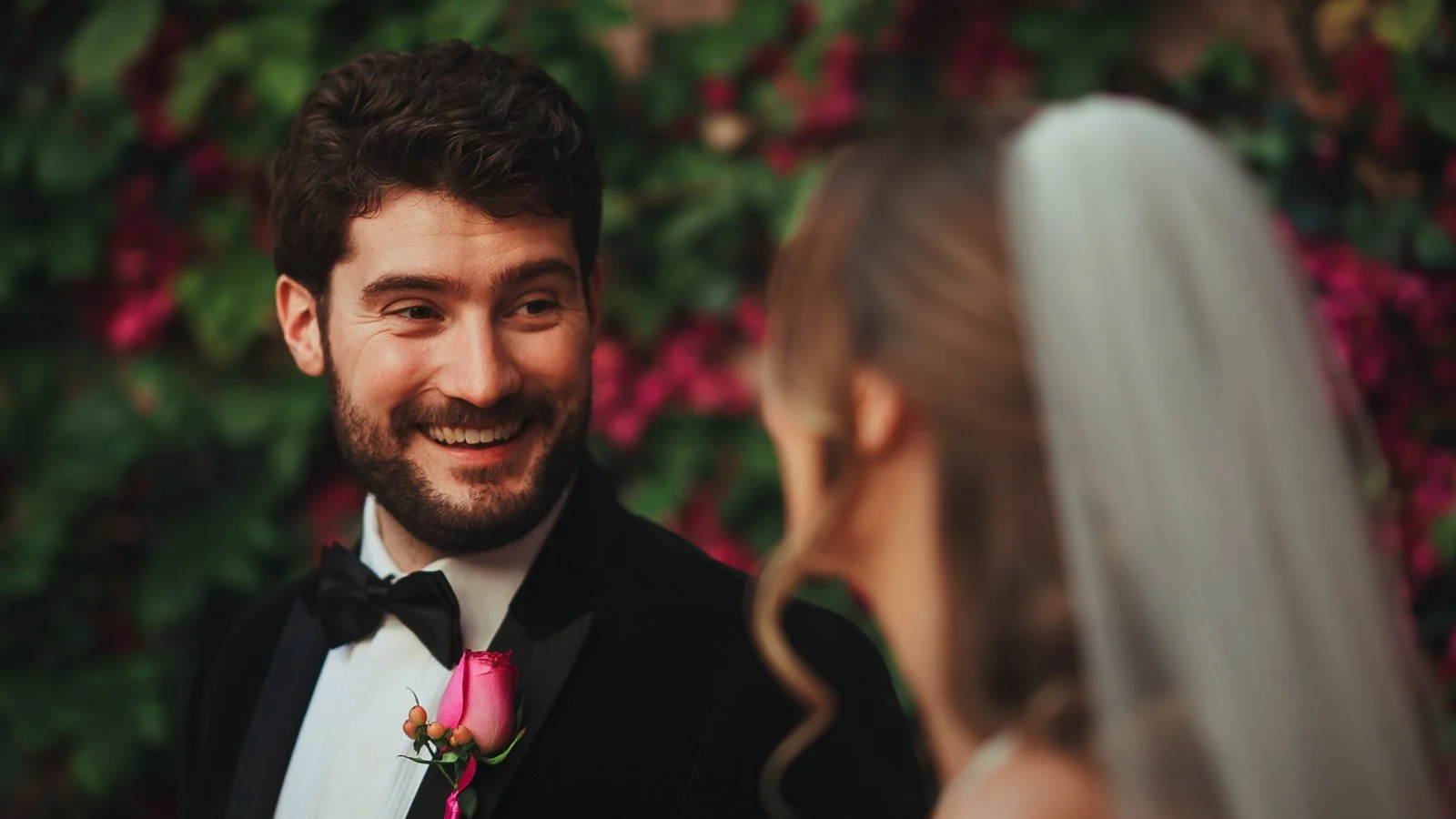 Editorial wedding portrait with vivid florals and refined composition