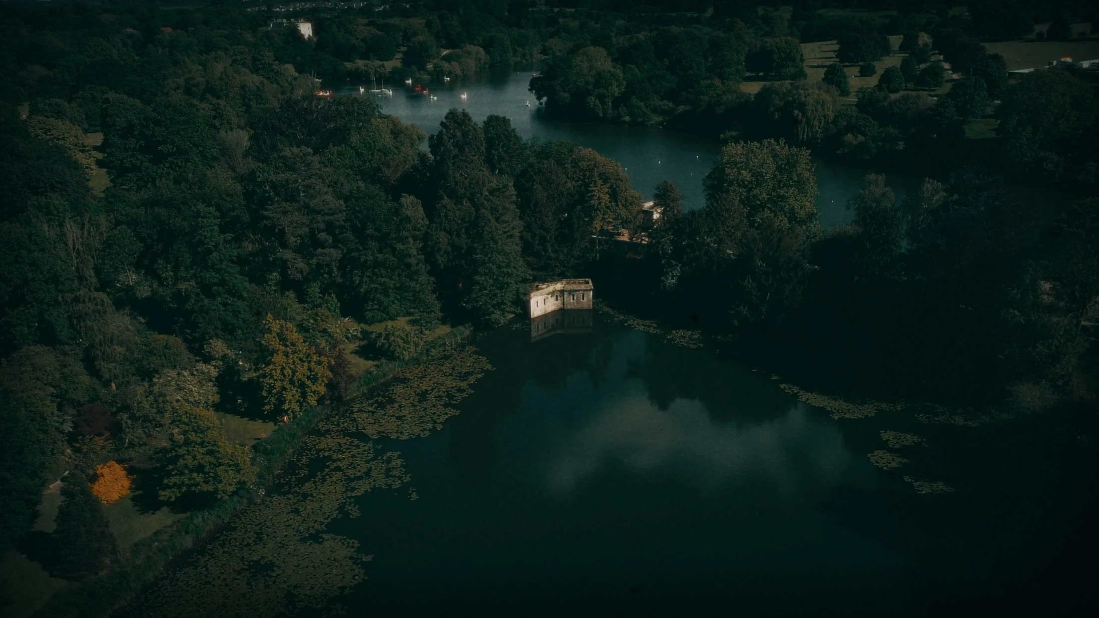 An aerial drone shot across the lake at The Orangery Maidstone in Kent, UK.