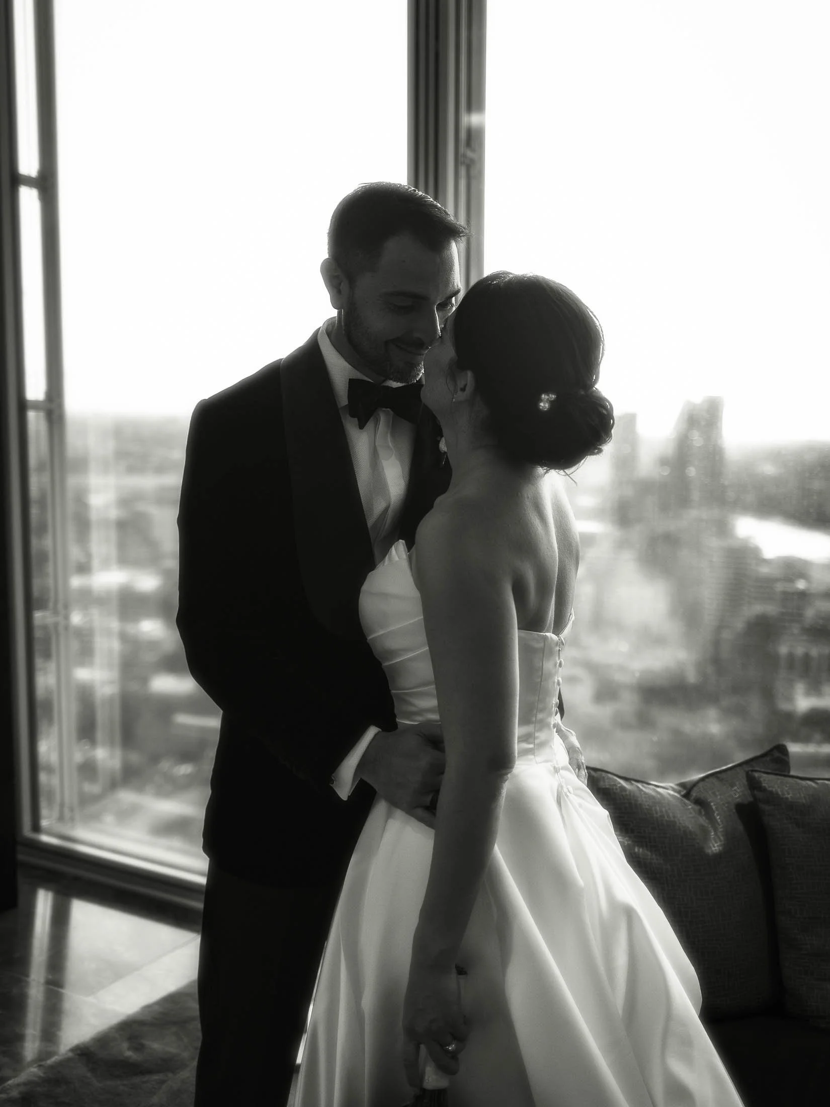A romantic black and white editorial-style couples portrait from a black tie London wedding.