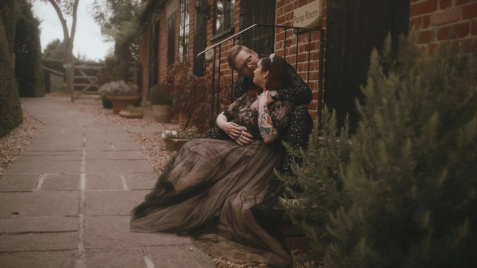 Bride and groom holding hands for a gothic-inspired Winters Barns wedding portrait
