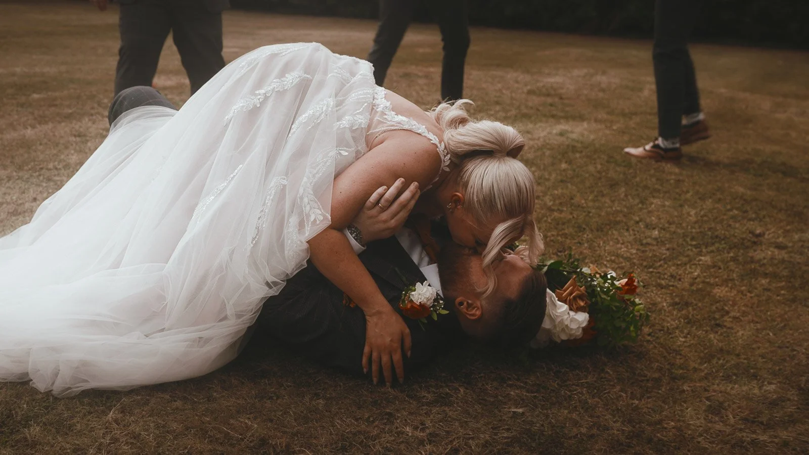 A couple walk through the grounds of their Winters Barns wedding.