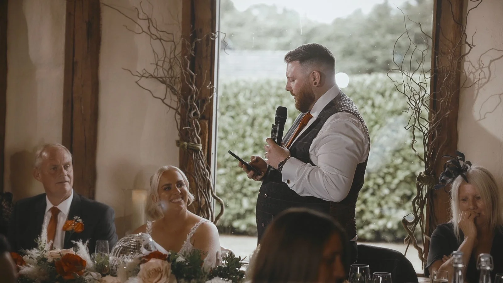 Speeches in the main barn at Winters Barns as the groom speaks to his bride.