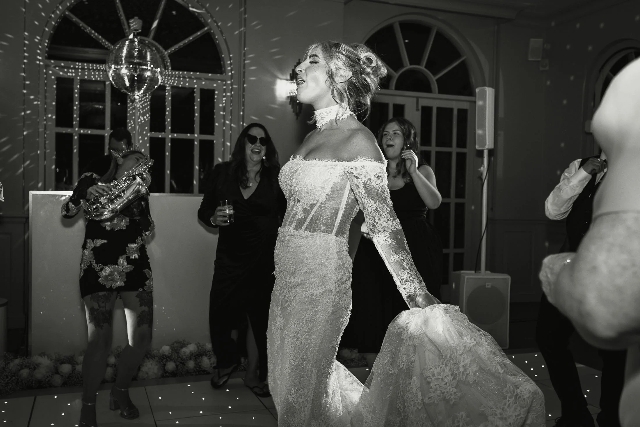 Editorial wedding photography and videography at The Orangery Maidstone with a bride dancing on the dance floor.