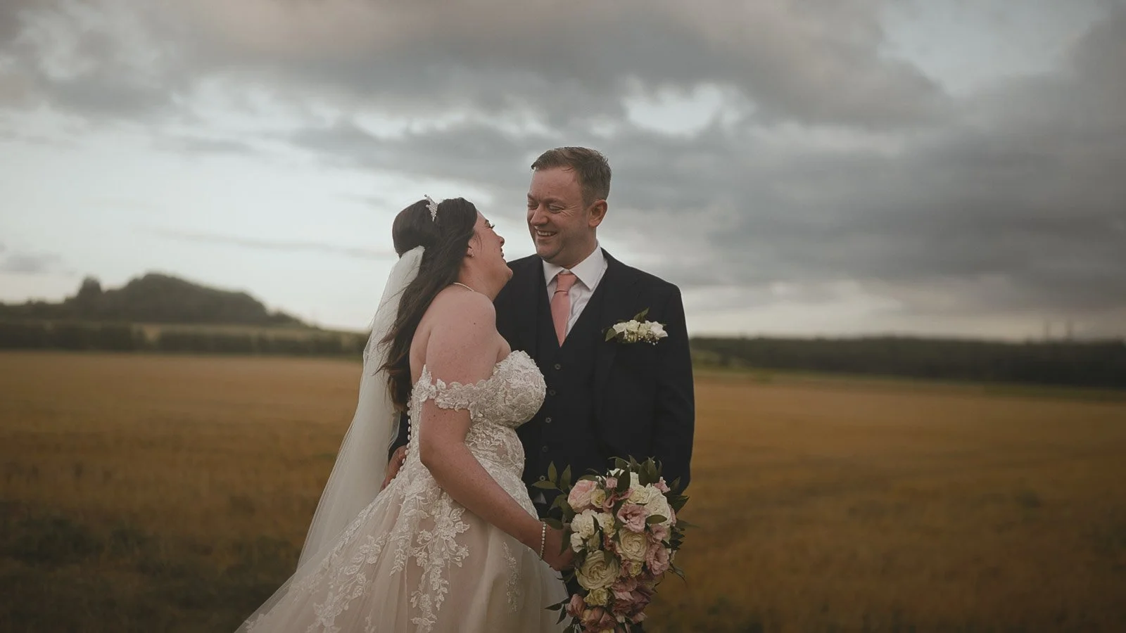 Emotional close-up portrait during golden hour at a Cooling Castle Barn wedding