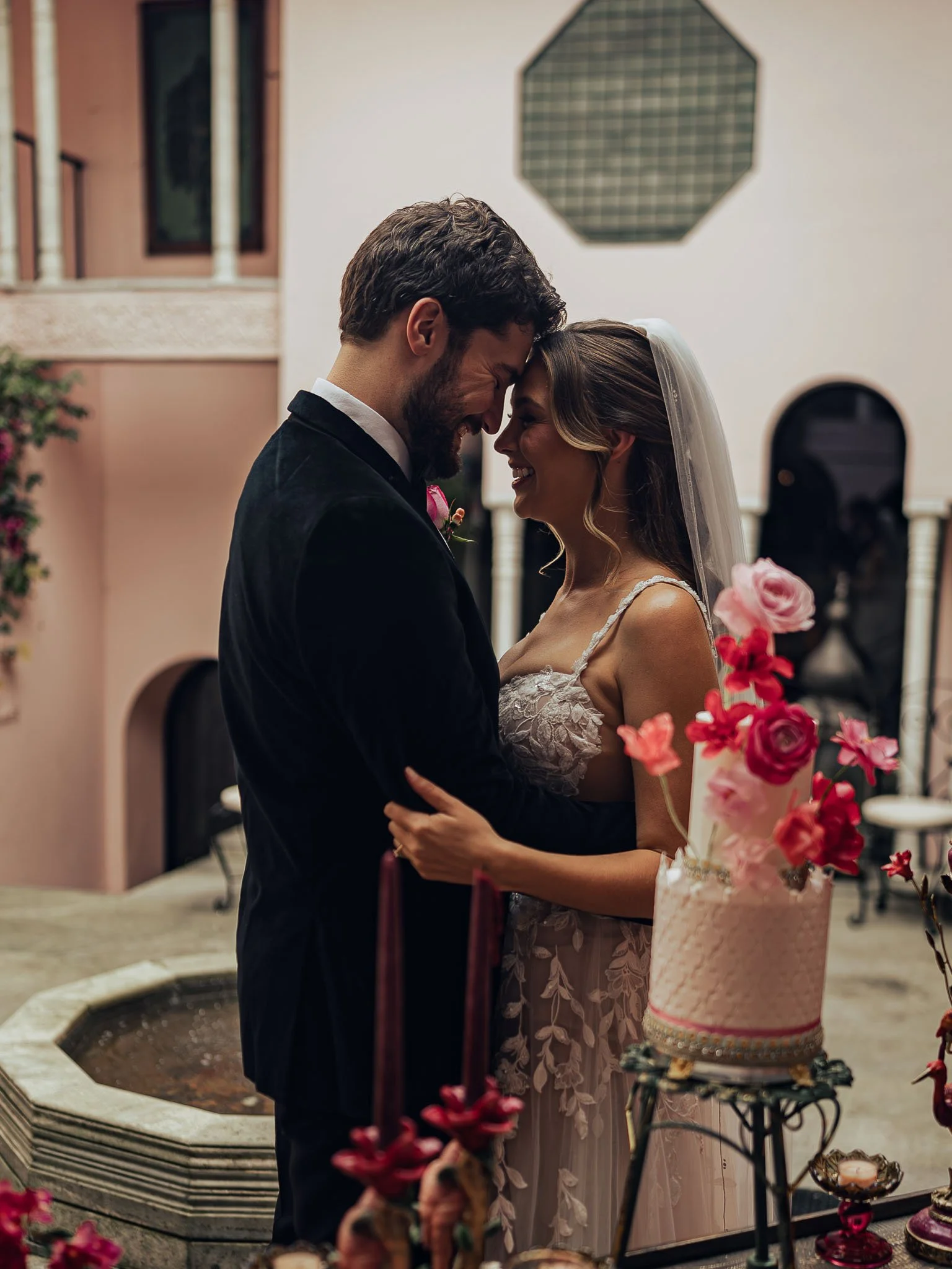 Bride and groom embracing post-ceremony, soft light and calm framing