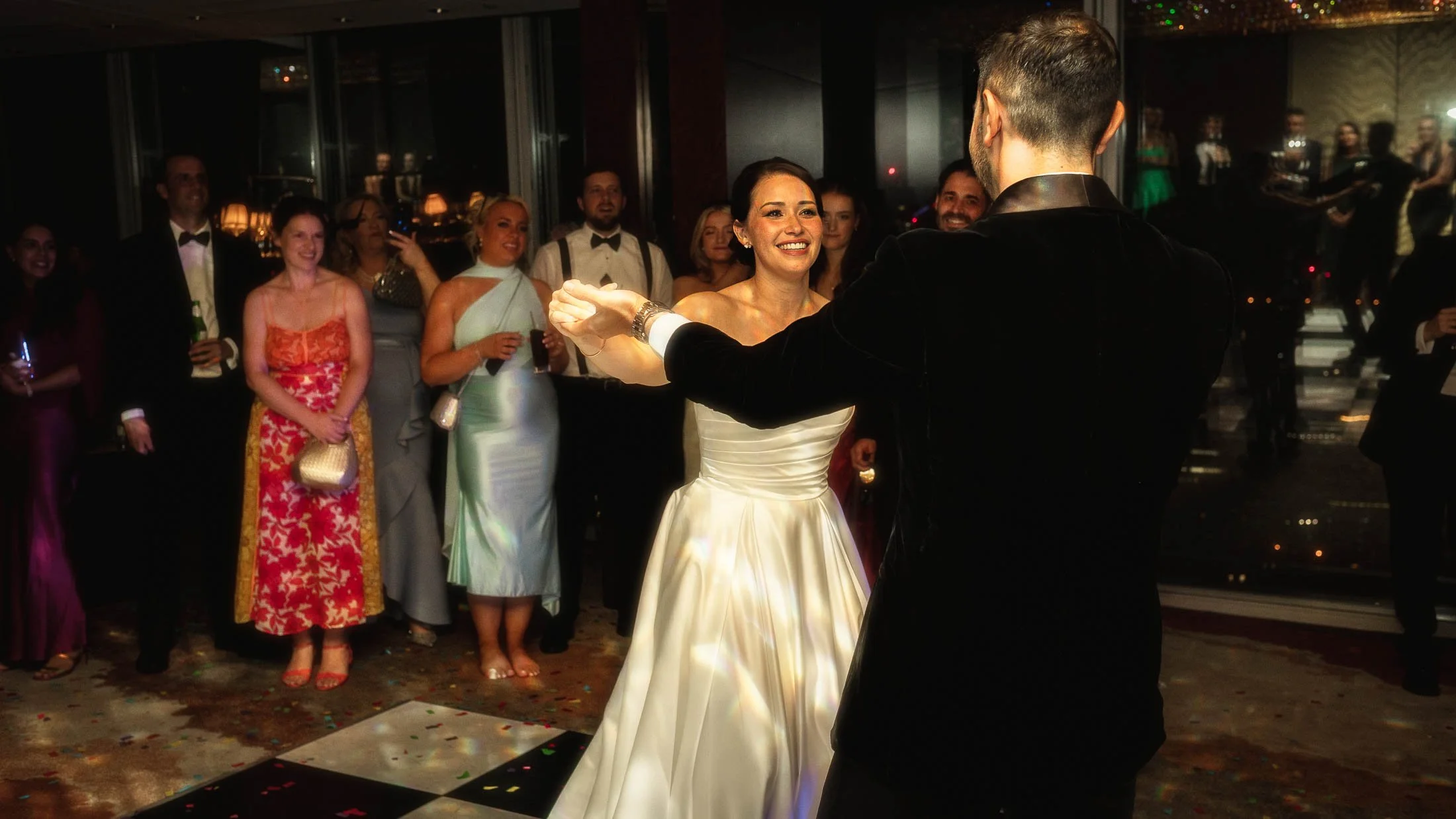 A bride and groom share their first dance on their London wedding day.