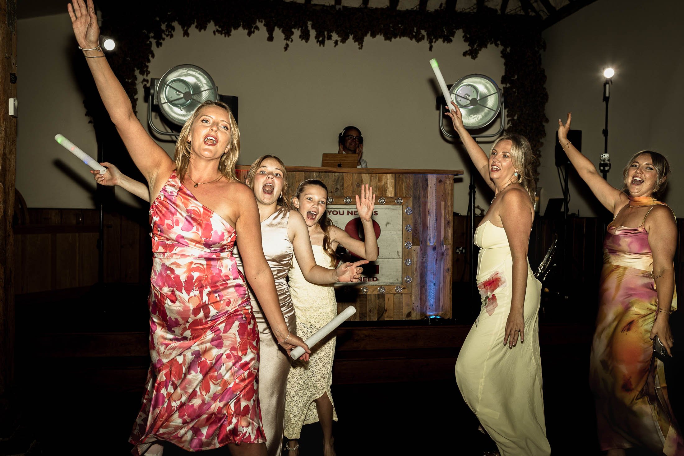 A wedding photograph taken from Winters Barns in Kent, showing a high-energy dance floor.
