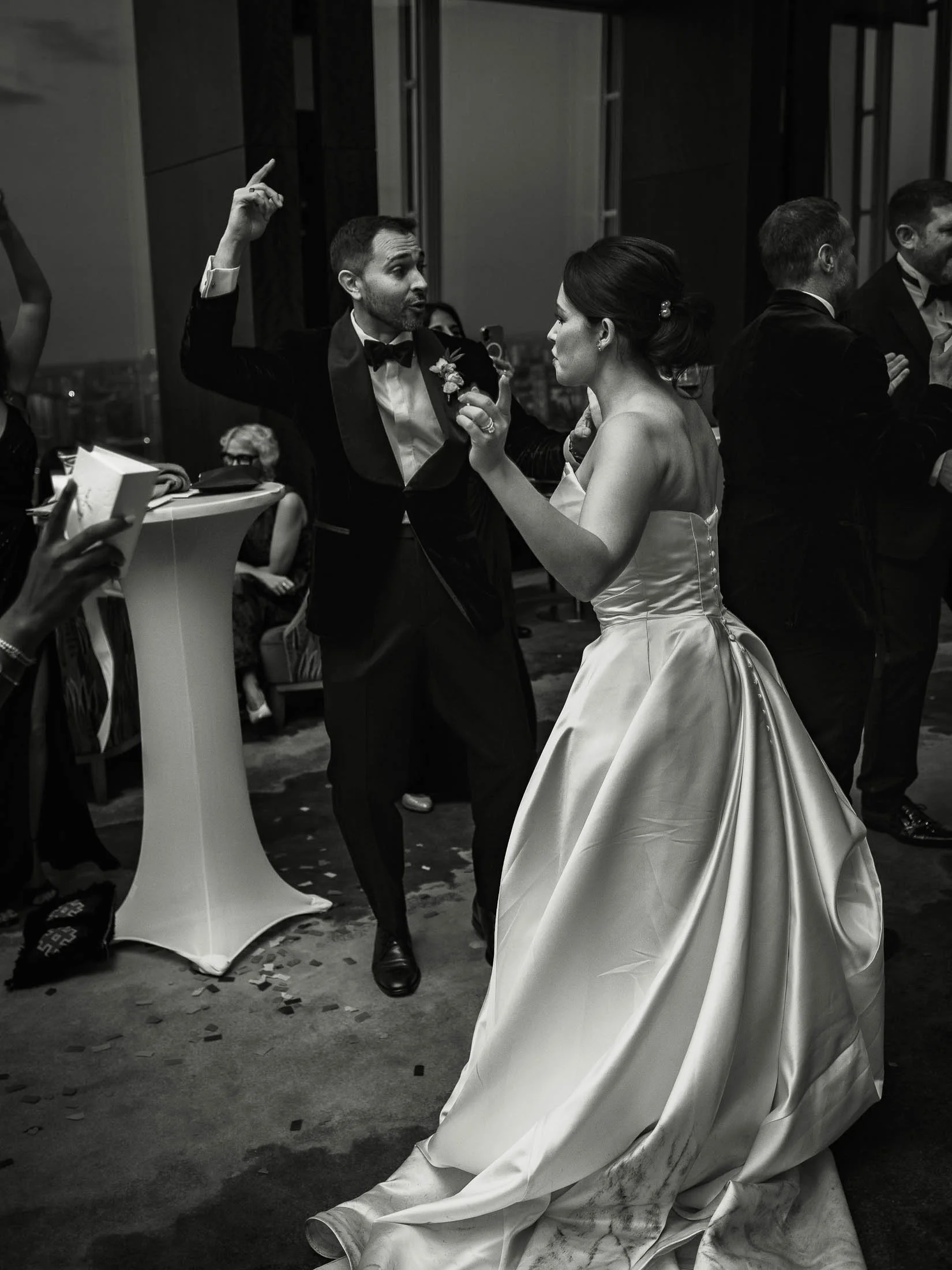 A black and white editorial wedding photo showing a bride and groom dancing during the Shangri_la Hotel black tie wedding at the SHard.