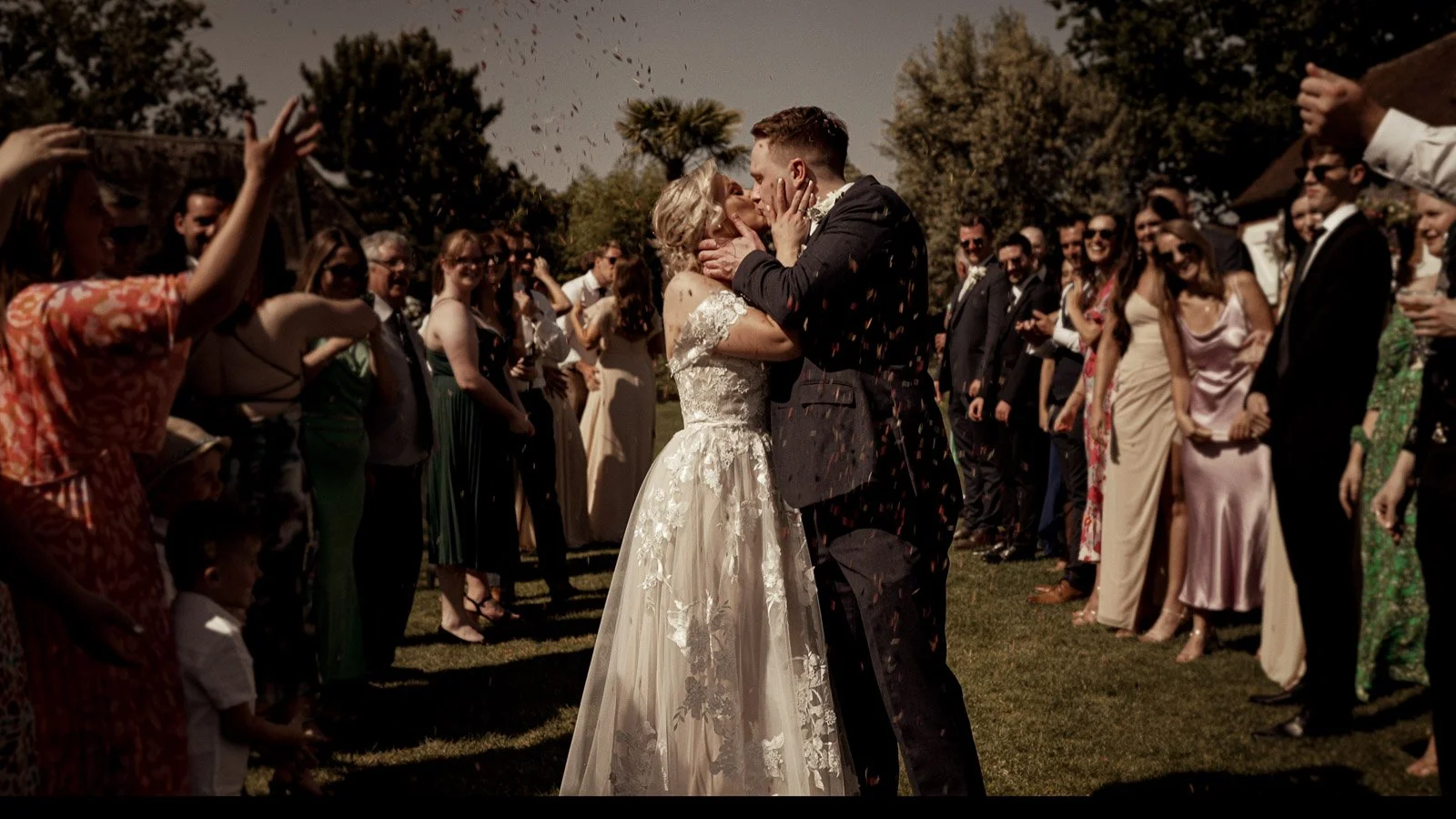 Confetti exit moment filmed at Cooling Castle Barn wedding in Kent