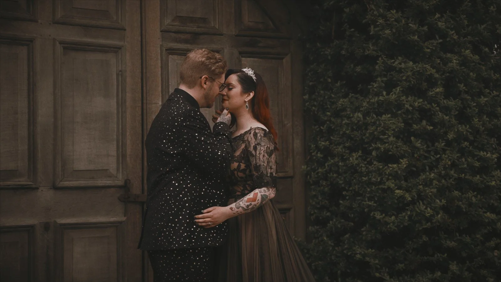 Moody, cinematic portrait of bride and groom with soft background separation