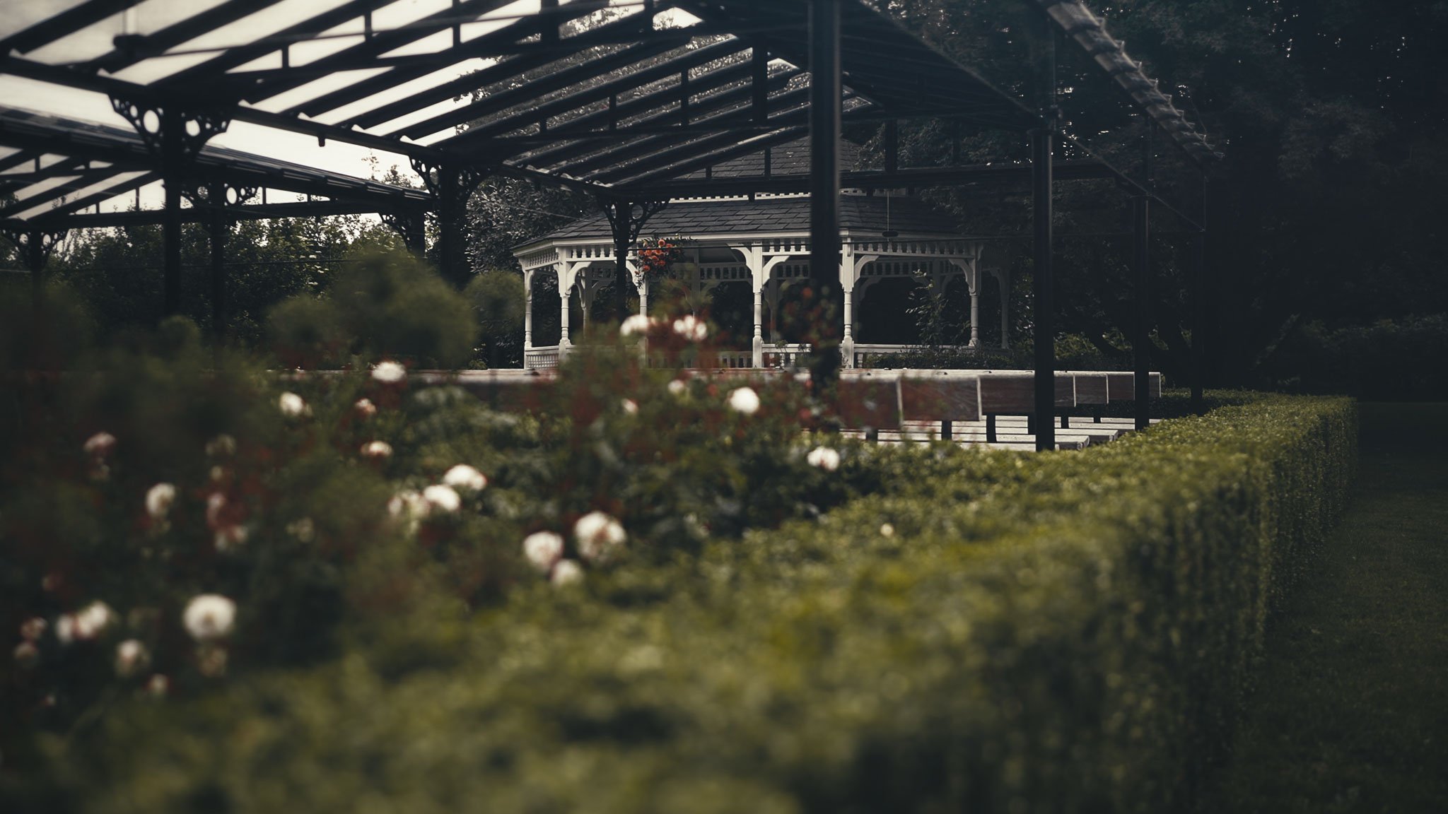 Bride walking down the aisle during an outdoor ceremony at The Old Kent Barn wedding venue