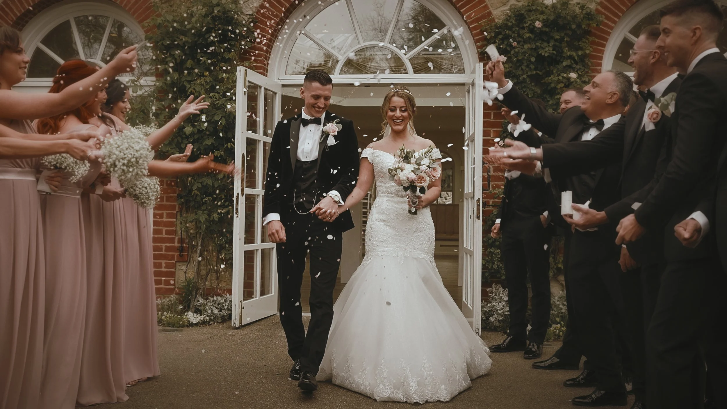 Editorial confetti moments from a black tie wedding day at The Orangery in Maidstone, Kent.