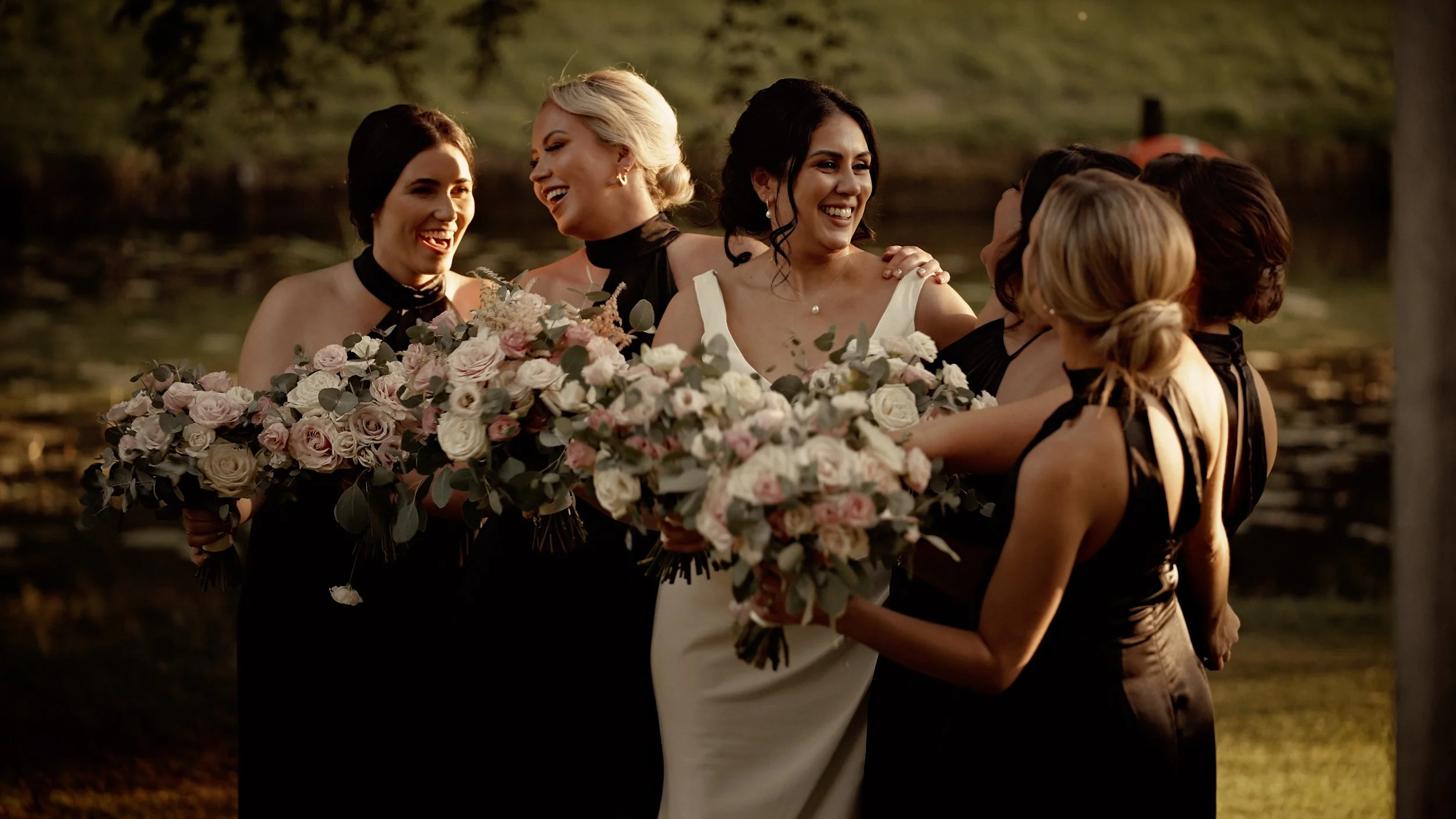 Bridesmaids laugh together with the bride at The Lapa at The Orangery Maidstone