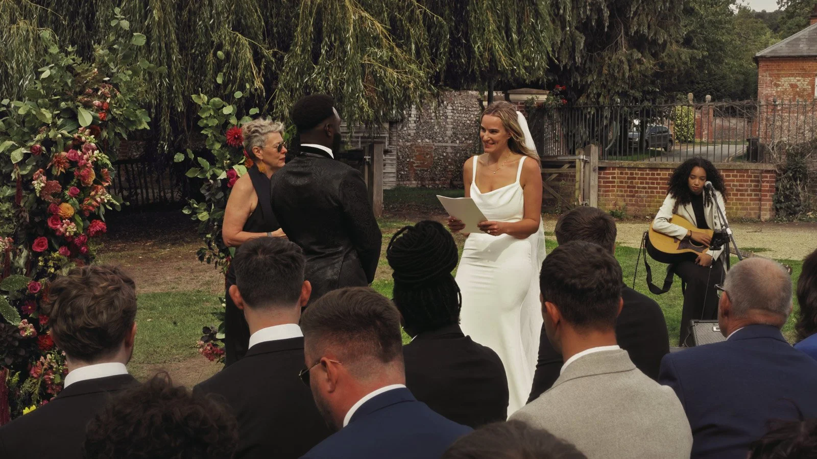 Candid moments from a colourful riverside wedding on the River Thames at an Oxfordshire country estate.