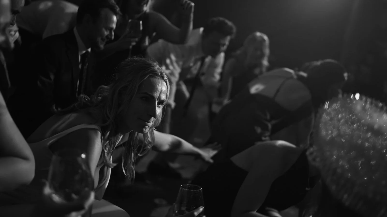 Editorial-style wedding photography from a colourful riverside celebration with bold florals and a marquee reception.