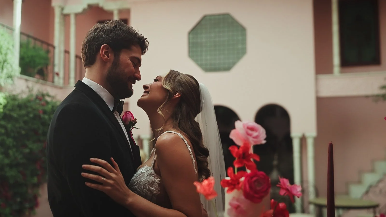 Bride and groom laughing together during their colourful summer wedding at port Lympne.