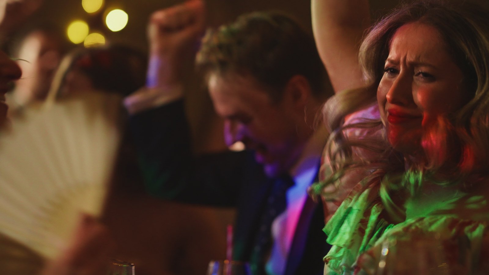 Guests and atmosphere from a colourful riverside wedding with black-tie styling and a marquee party on the Thames.