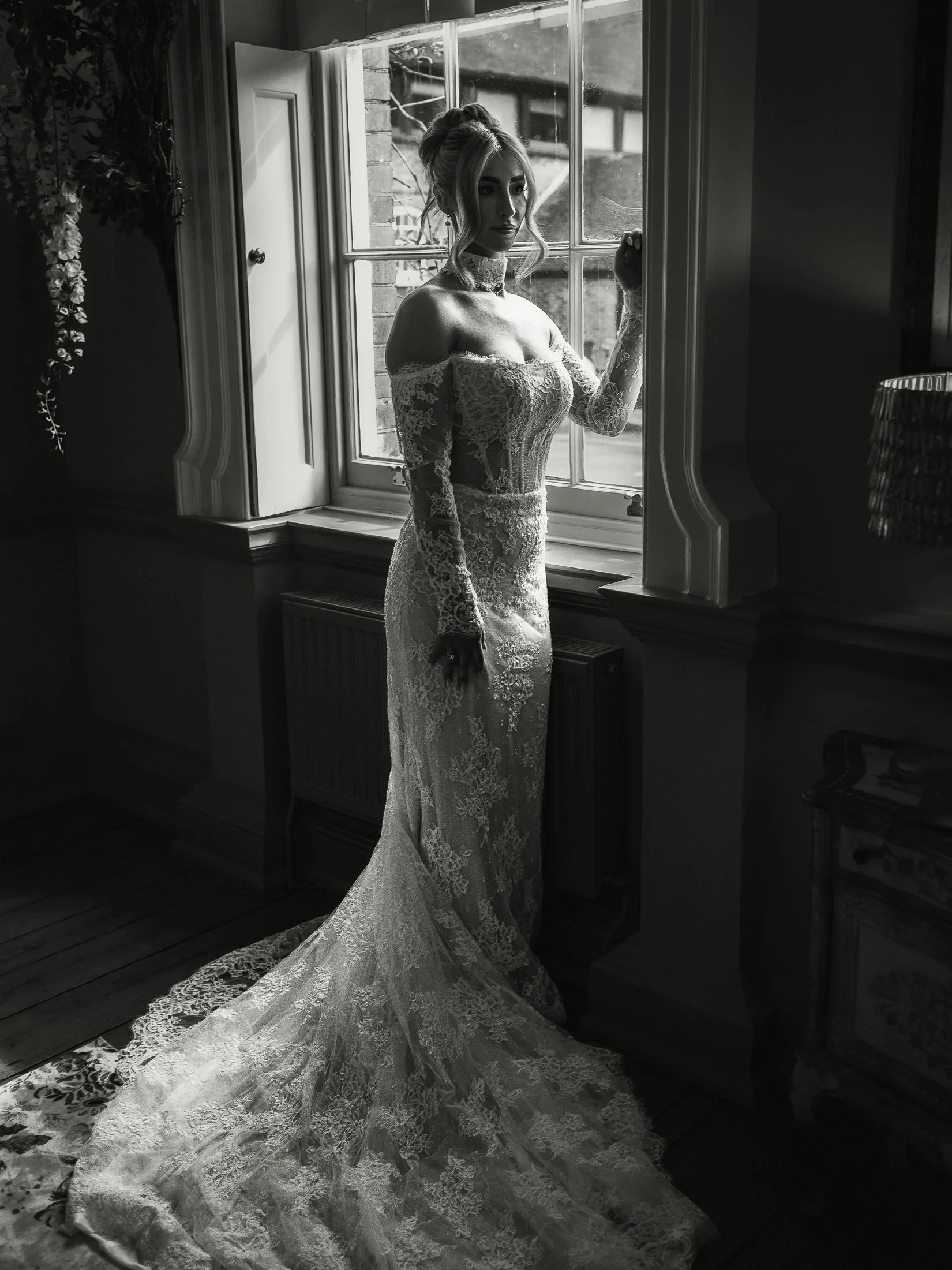 Editorial black and white bridal portrait captured in the Wisteria Suite at The Orangery Maidstone wedding venue in Kent, by a photography and videography team.
