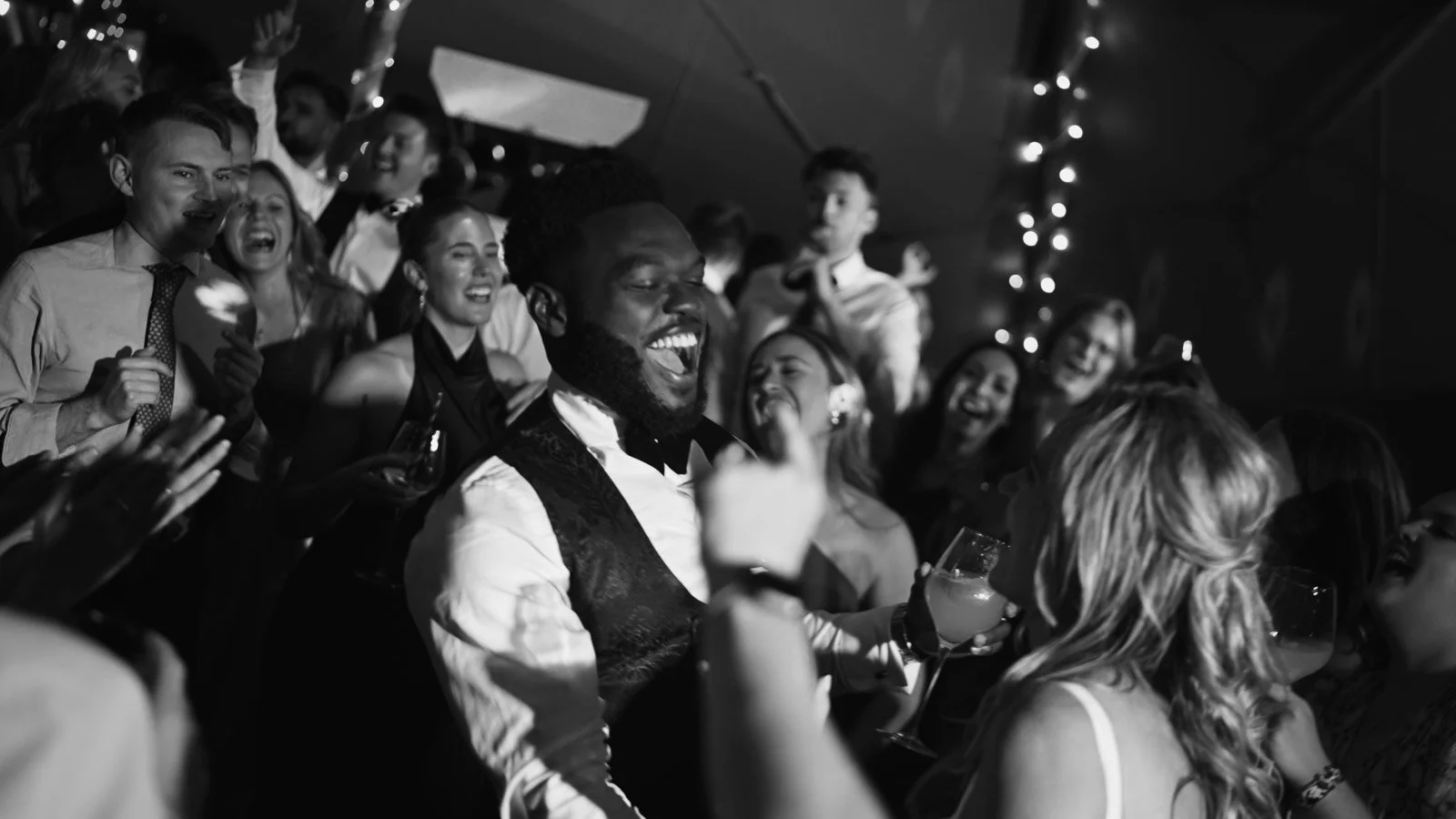 Candid moments from a colourful riverside wedding on the River Thames at an Oxfordshire country estate.