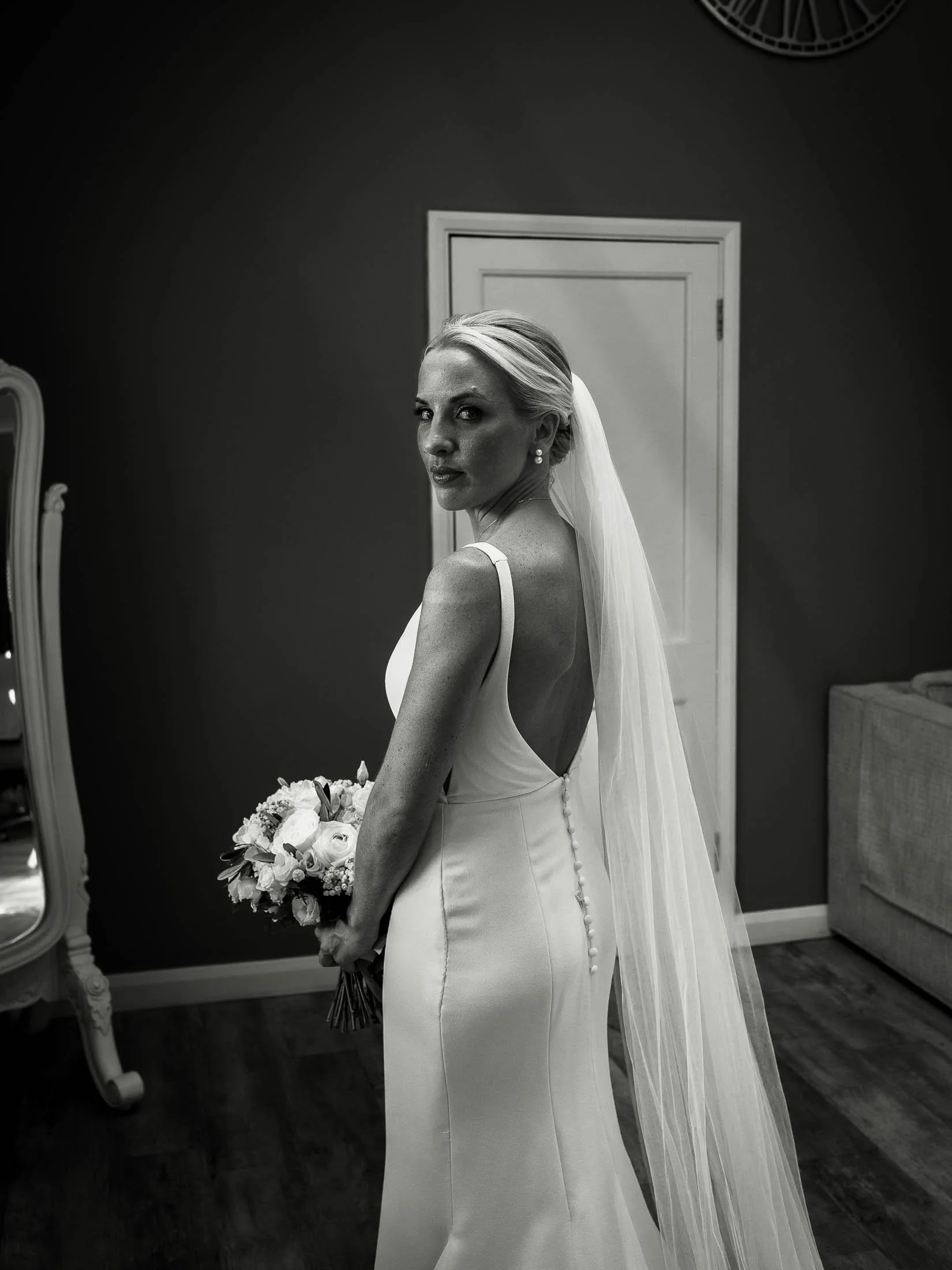 A black and white editorial bridal portrait taken at winters barns in kent.