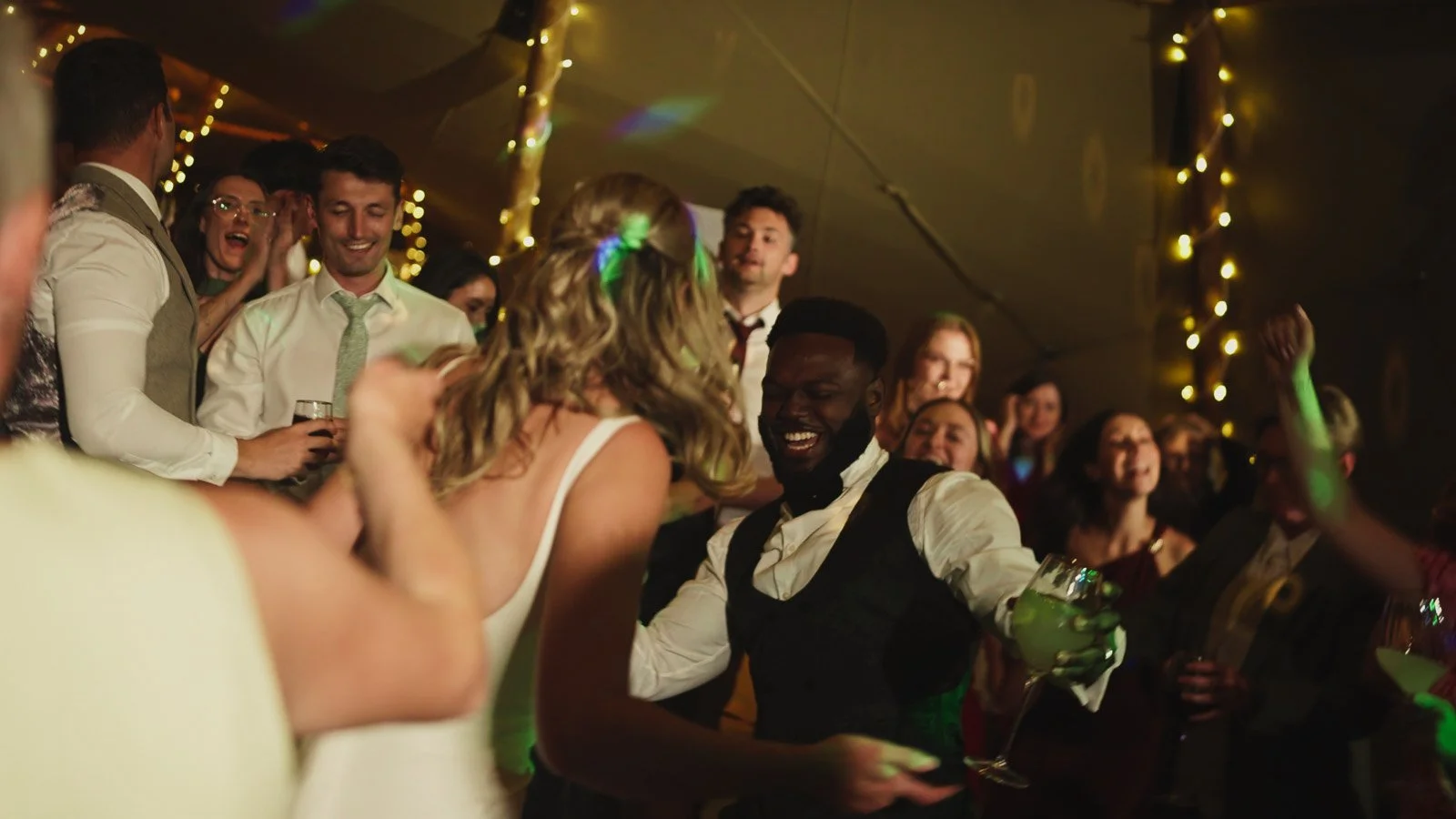 Candid moments from a colourful riverside wedding on the River Thames at an Oxfordshire country estate.