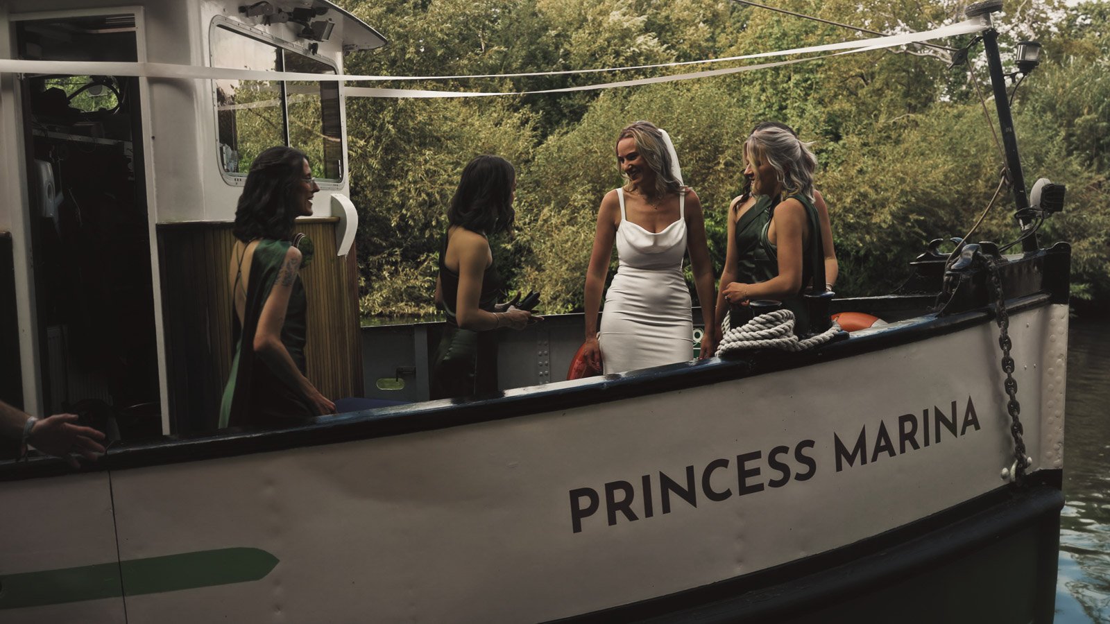 Details and candid scenes from a colourful riverside wedding video at an Oxfordshire estate beside the River Thames.