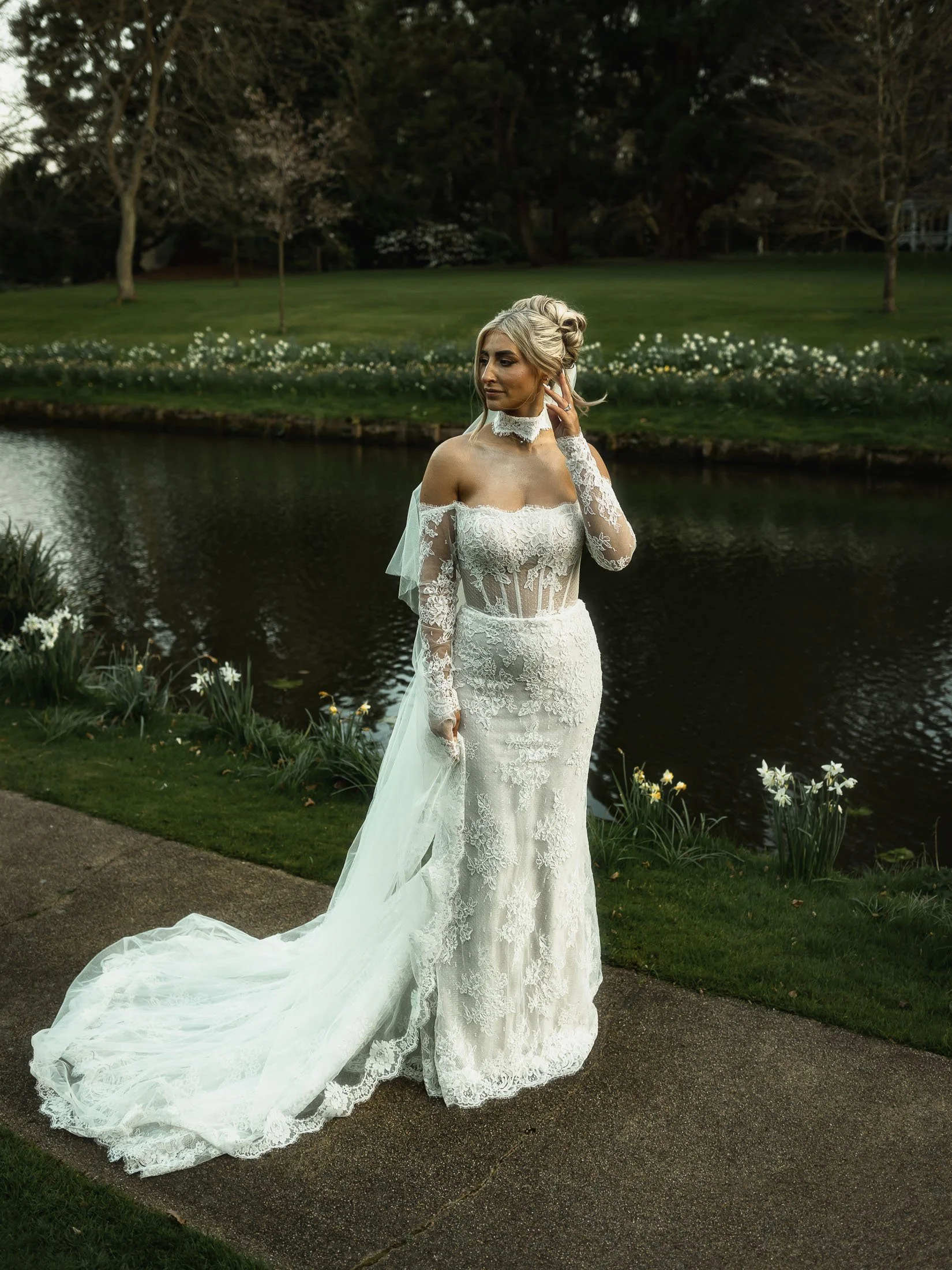 Natural light full length editorial portrait of bride during a wedding at The Orangery Maidstone, Kent.
