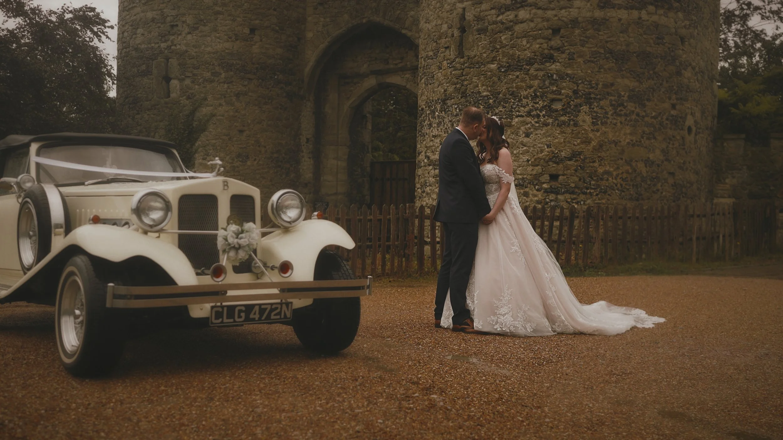 Couple portraits near the castle walls at Cooling Castle Barn, filmed naturally