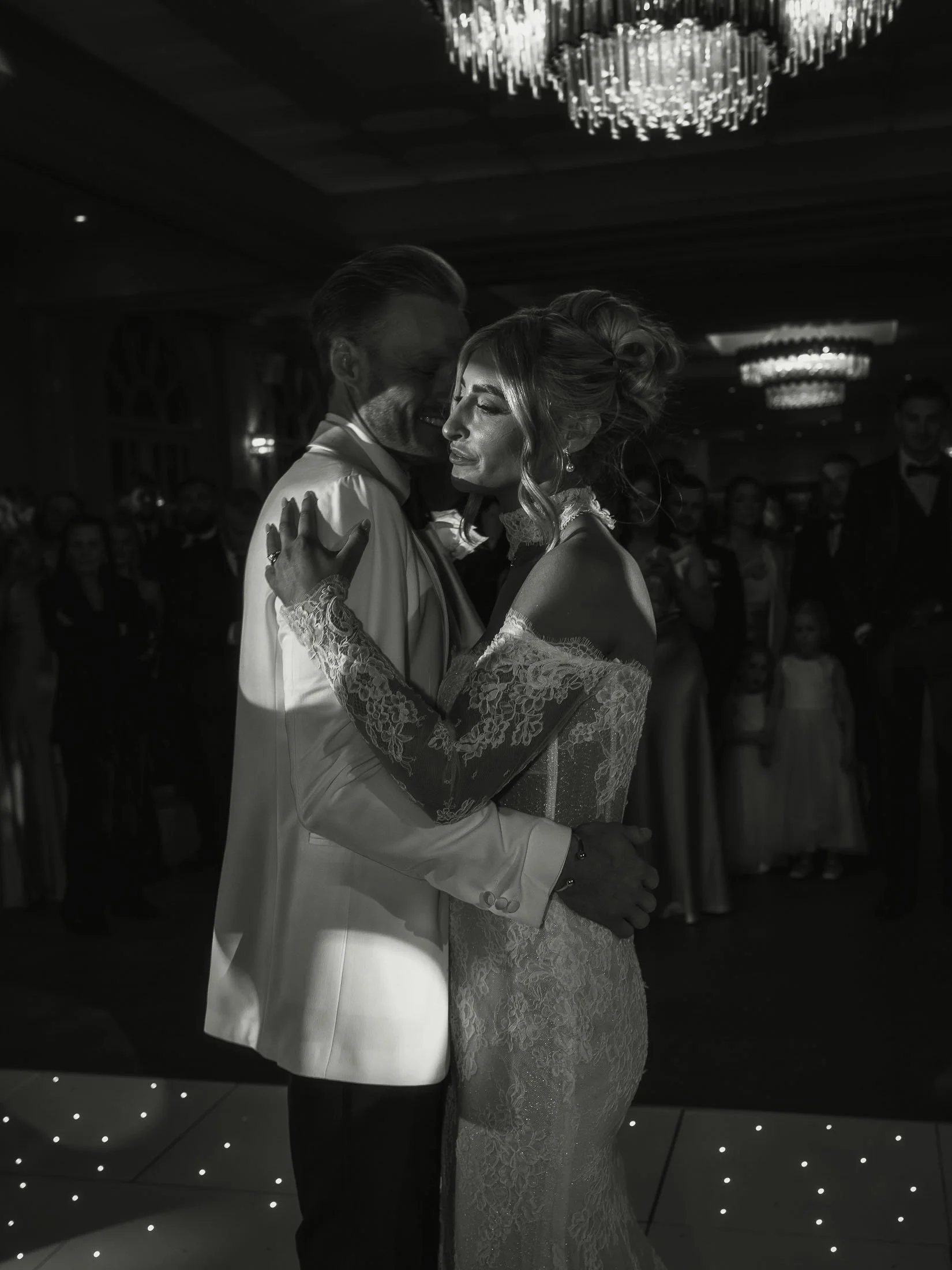 Black and white editorial image of a bride and grooms first dance at The Orangery Maidstone.