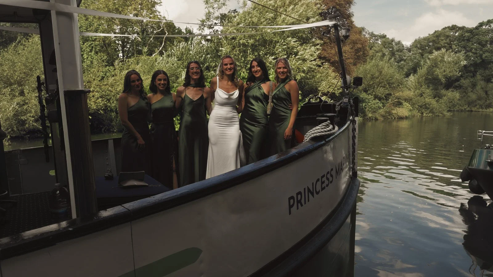 Details and candid scenes from a colourful riverside wedding video at an Oxfordshire estate beside the River Thames.