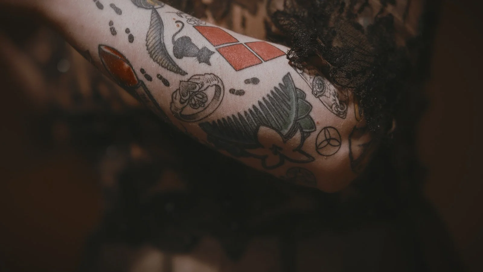 Bride holding a dried flower bouquet with tattoo details in a close-up shot