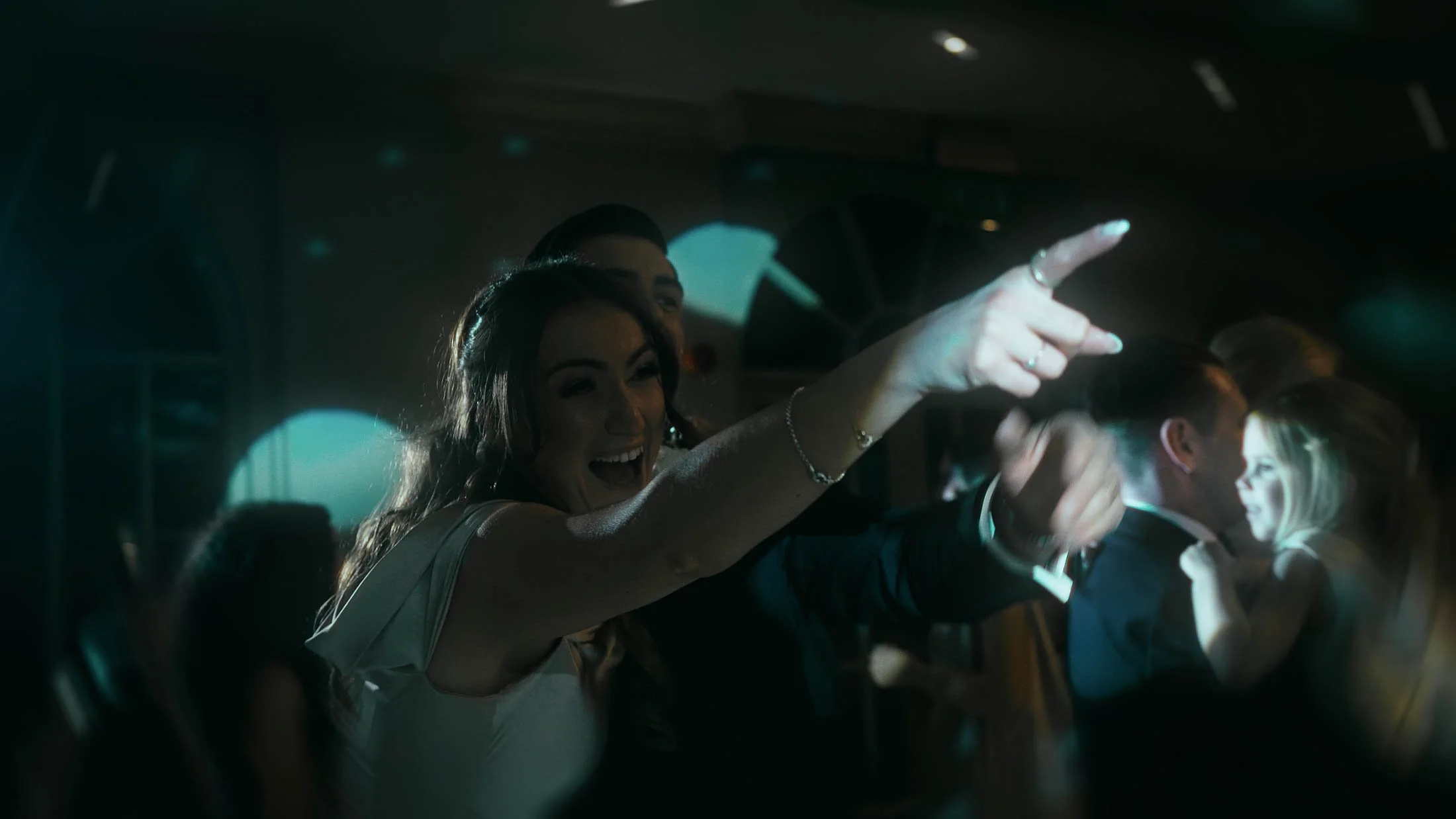 High-energy dance floor antics in a moment captured for a cinematic storytelling wedding film.