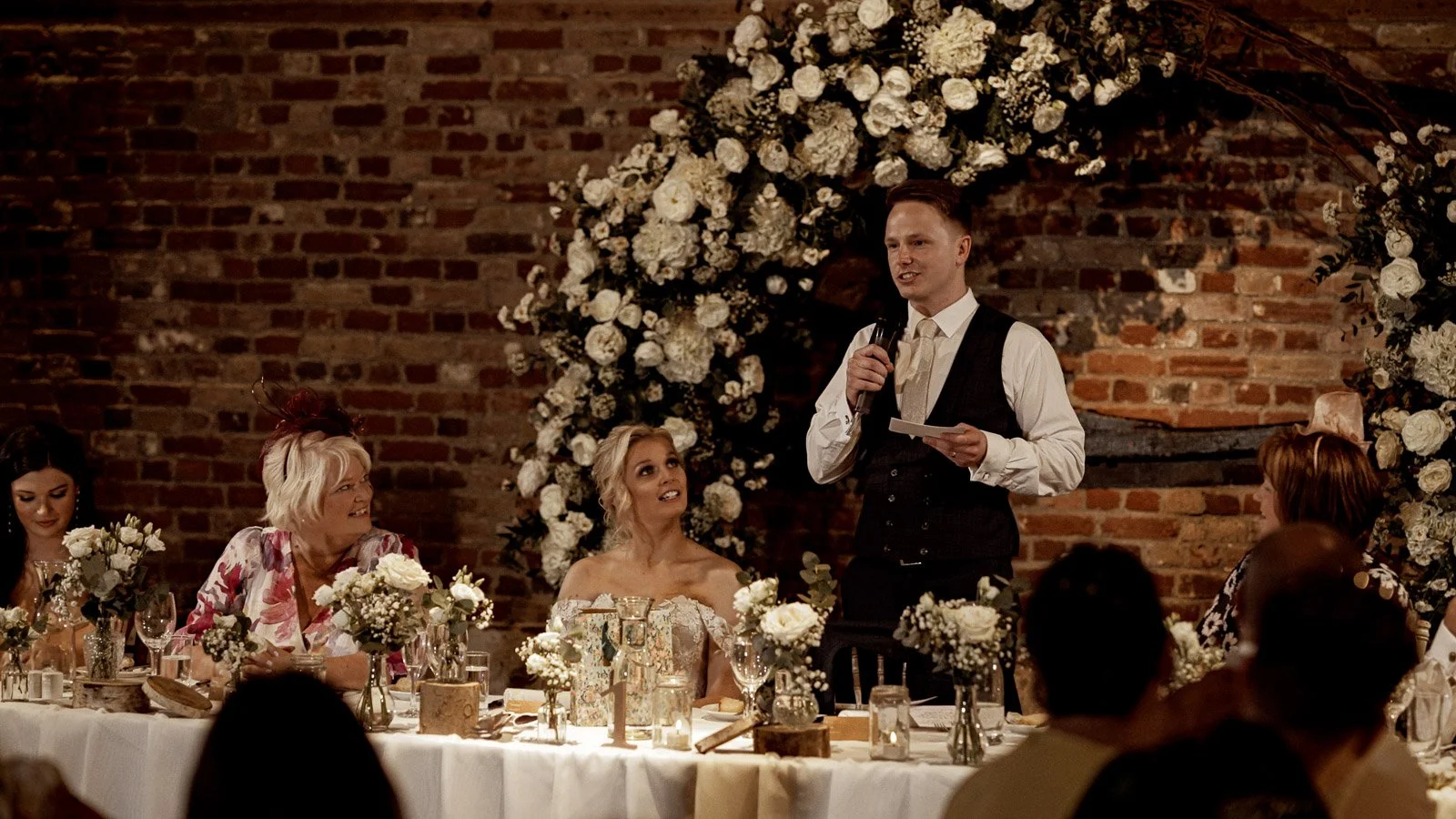 A groom delivers an emotional speech during a Cooling Castle Barn wedding film in Kent.