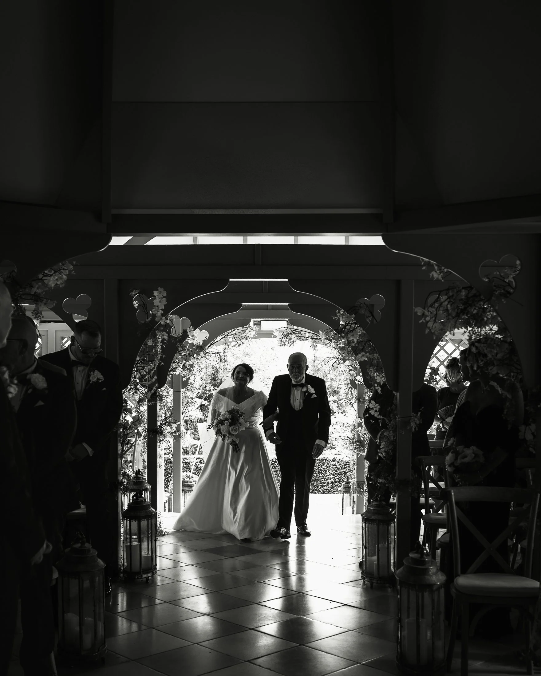 A bride enters her wedding ceremony at port Lympne.