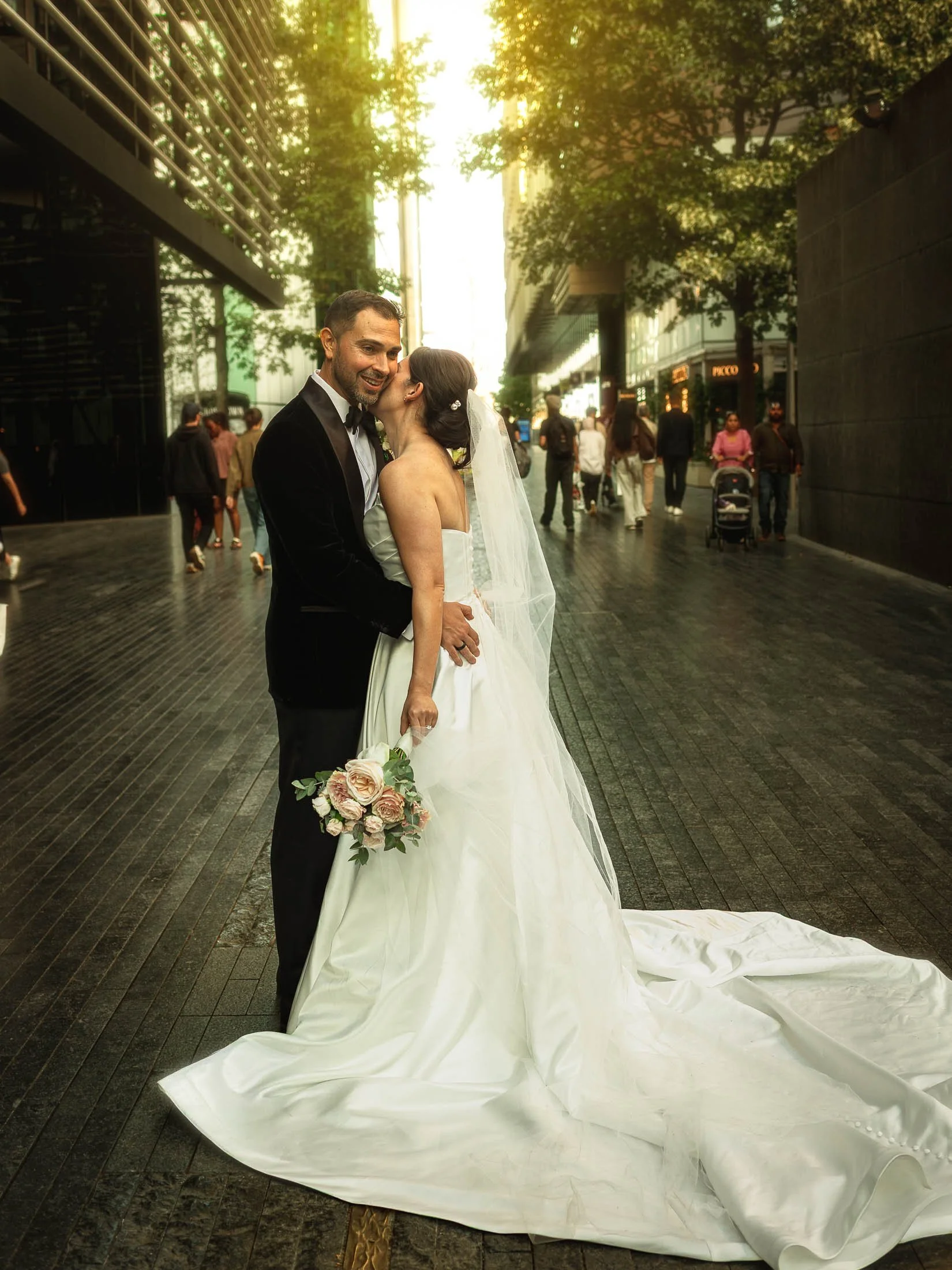 A romantic golden hour couples portrait taken at London Bridge during an international London wedding with black tie aesthetic at The Shard, London.